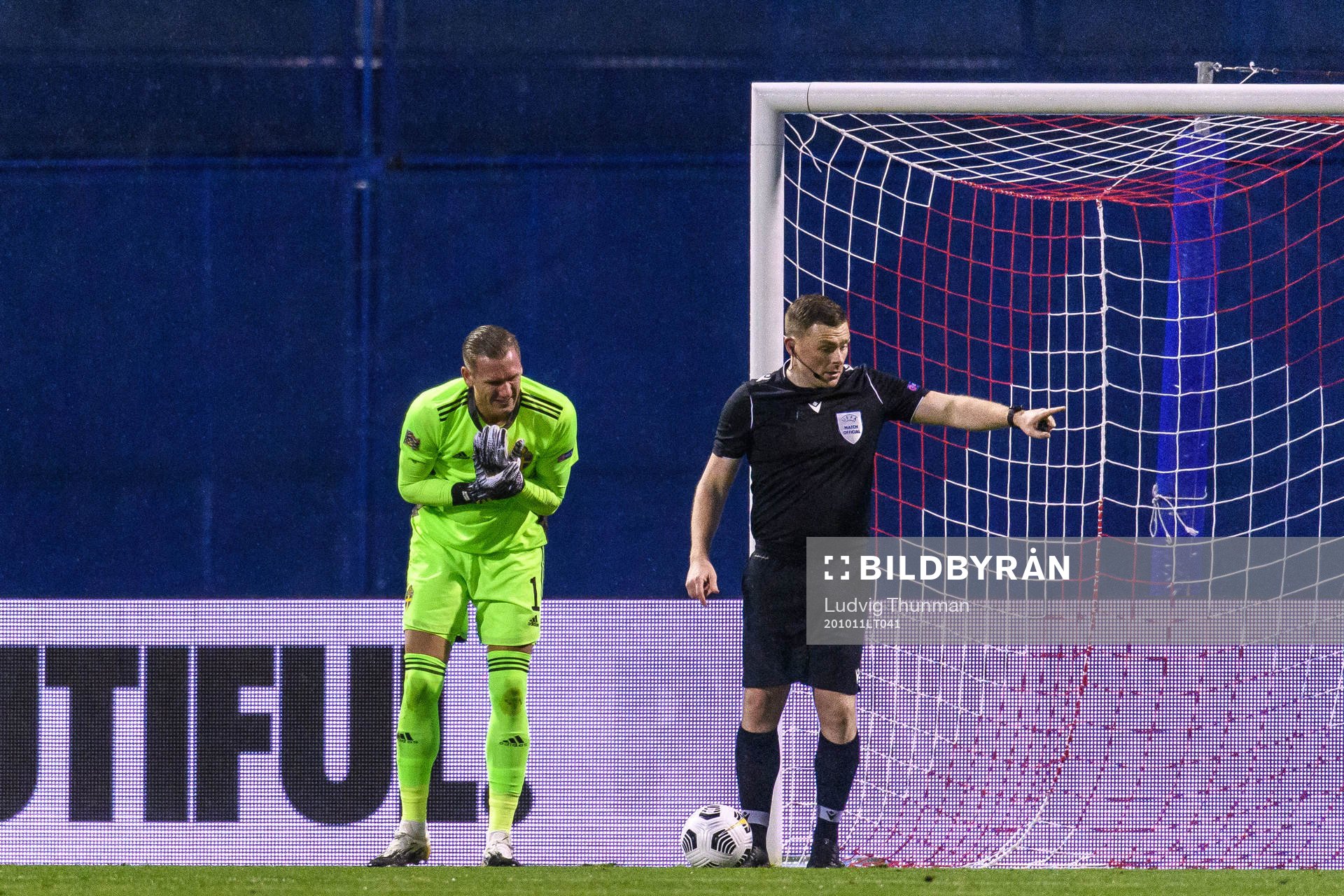 Goalkeeper Robin Olsen of Sweden in pain