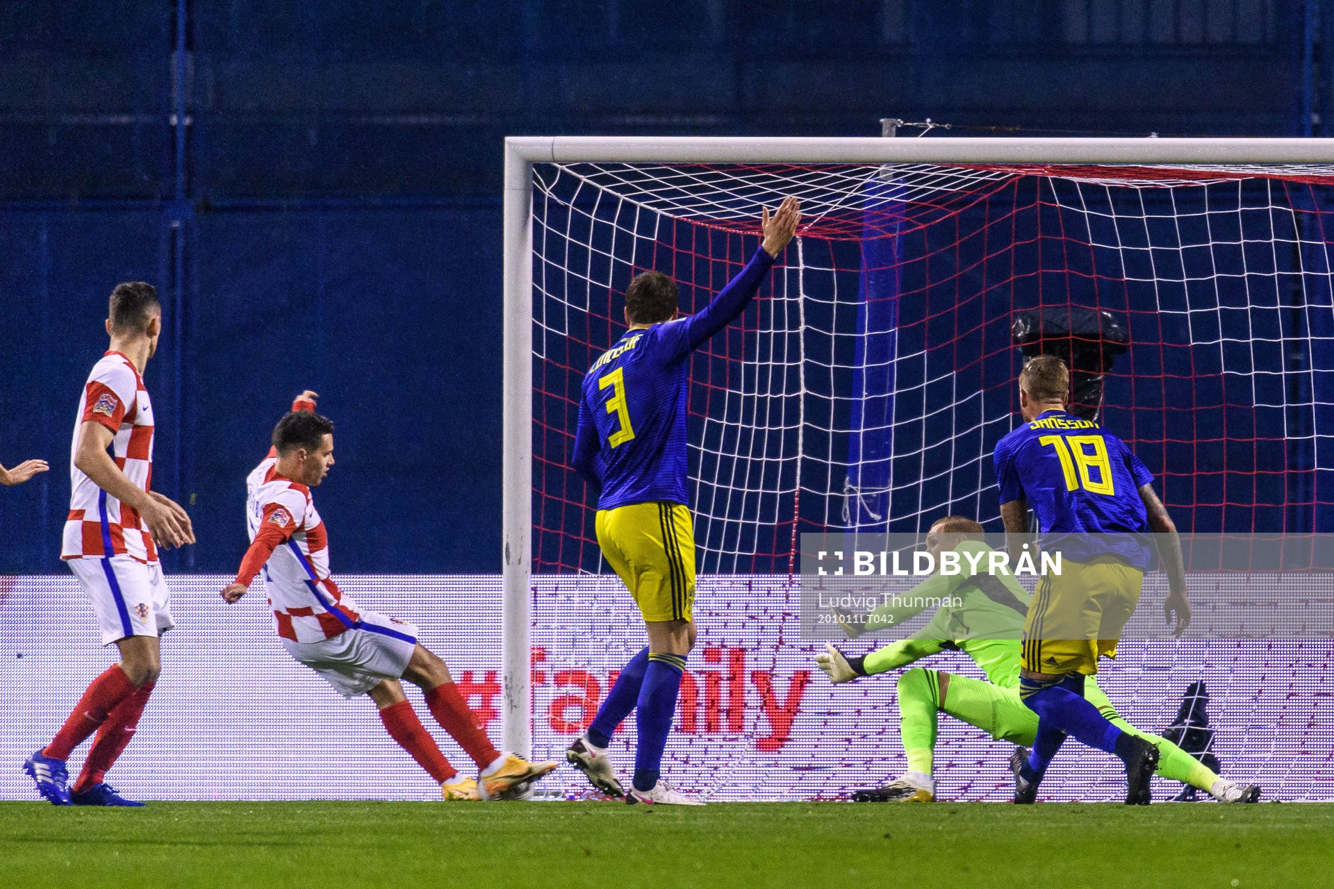 Goalkeeper Robin Olsen of Sweden lets in the 1-0 goal that