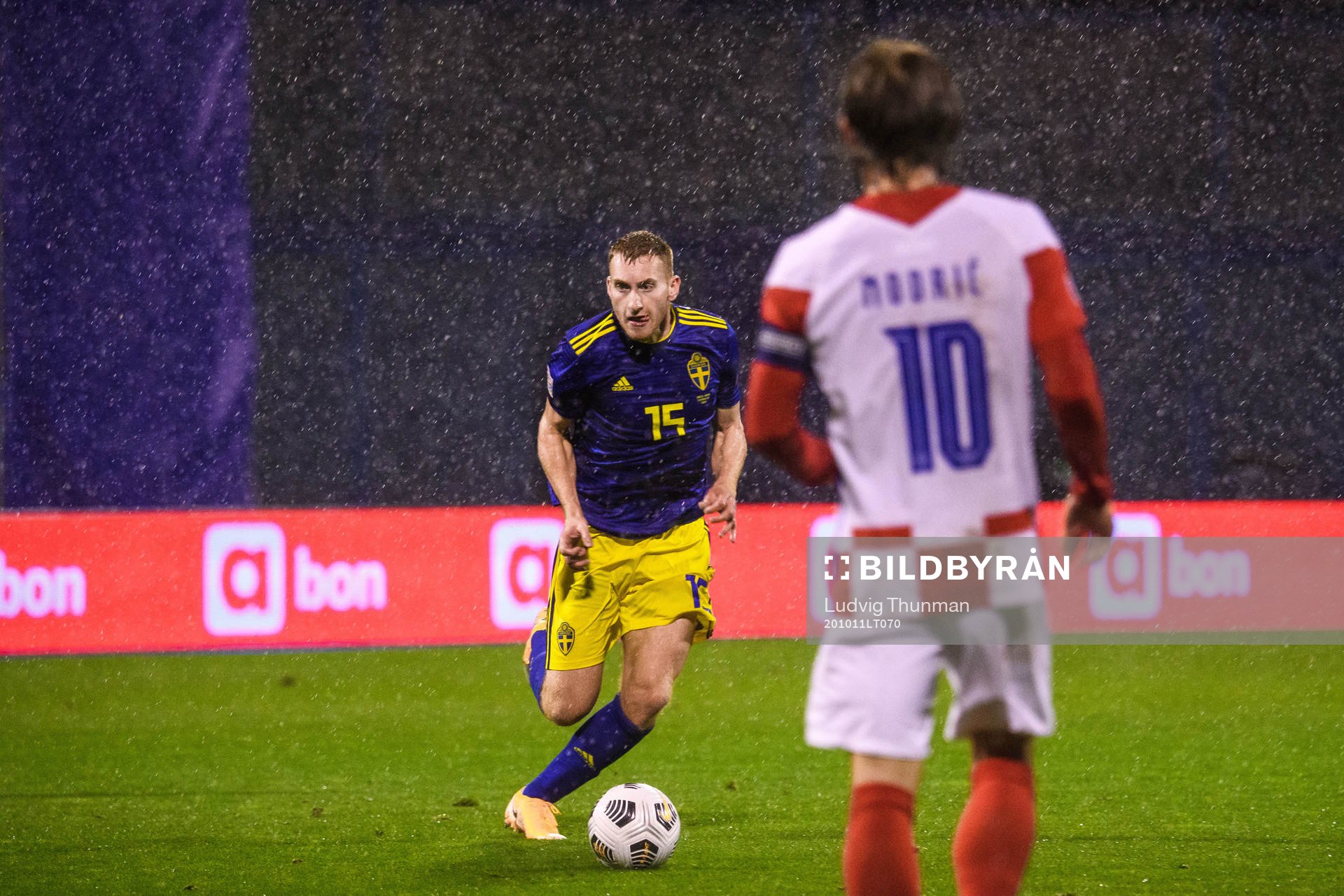 Dejan Kulusevski of Sweden and Luka Modric of Croatia