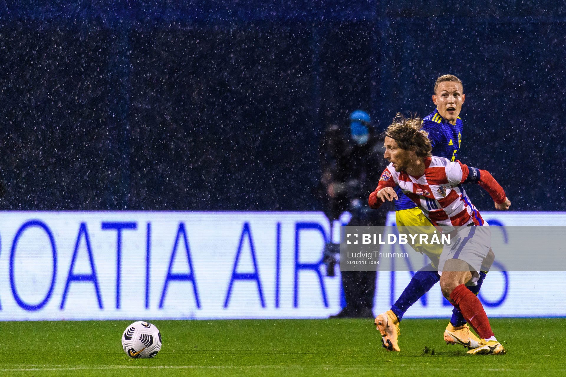 Ludwig Augustinsson of Sweden and Luka Modric of Croatia