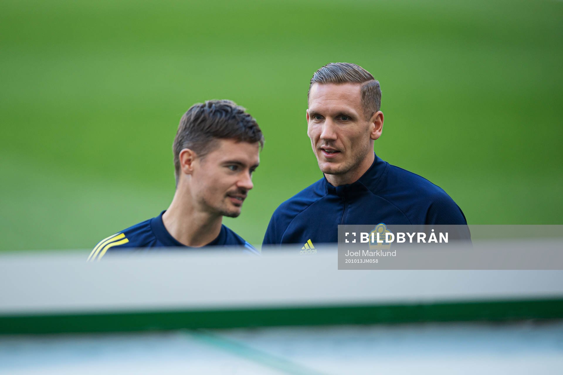 Mikael Lustig and goalkeeper Robin Olsen of the Swedish