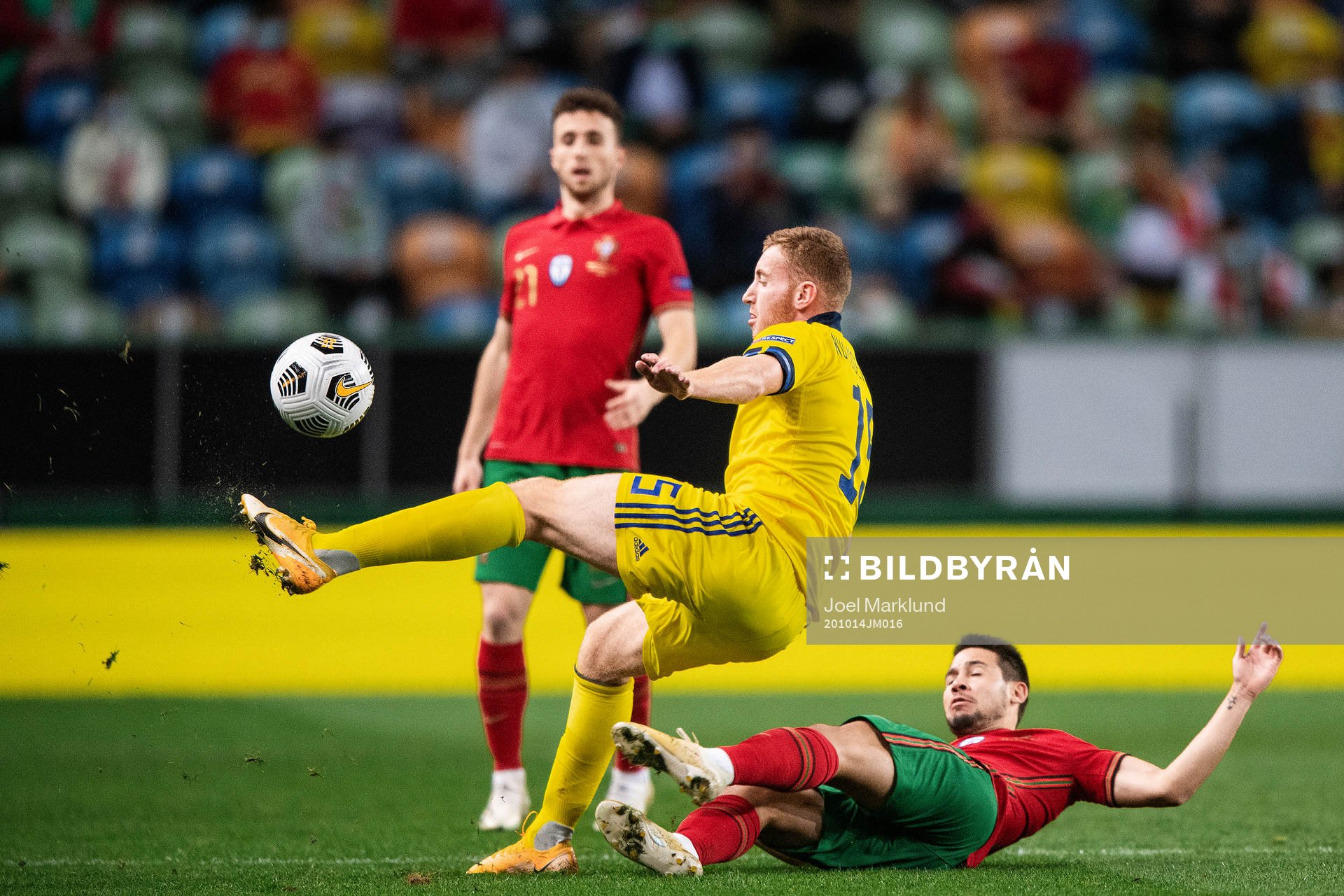 Dejan Kulusevski of Sweden and Raphael Guerreiro of Portugal
