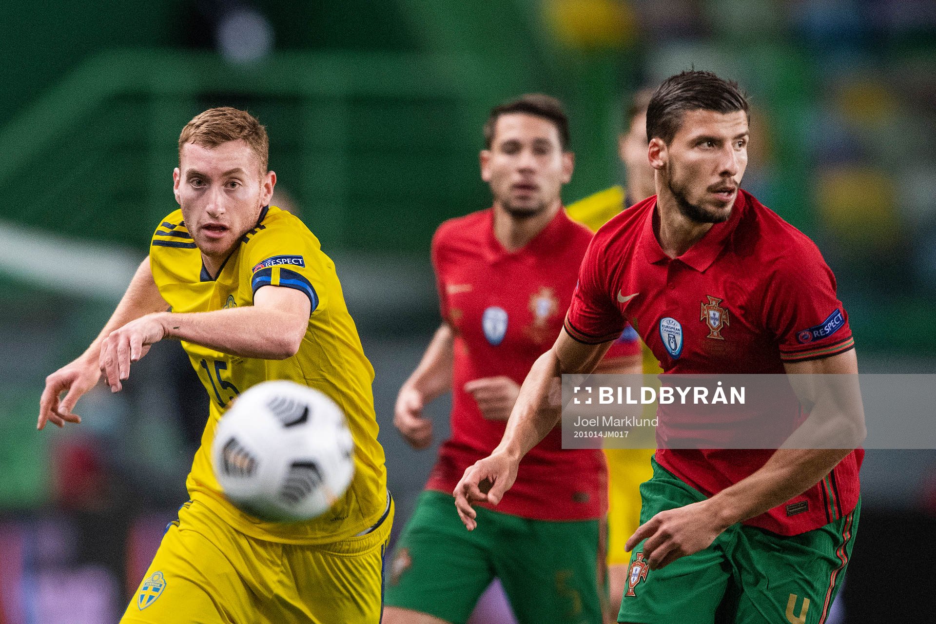 Dejan Kulusevski of Sweden and Ruben Dias of Portugal