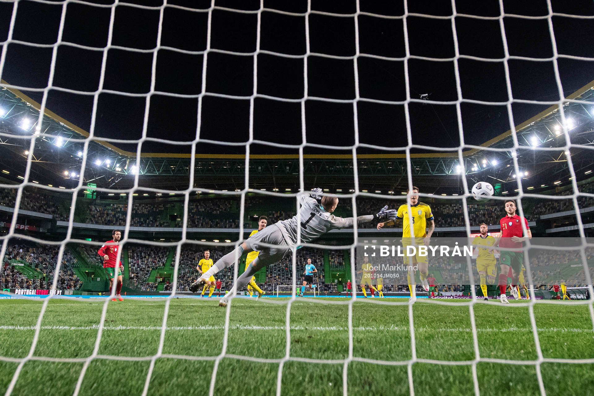 Bernardo Silva of Portugal scores 1-0 behind goalkeeper