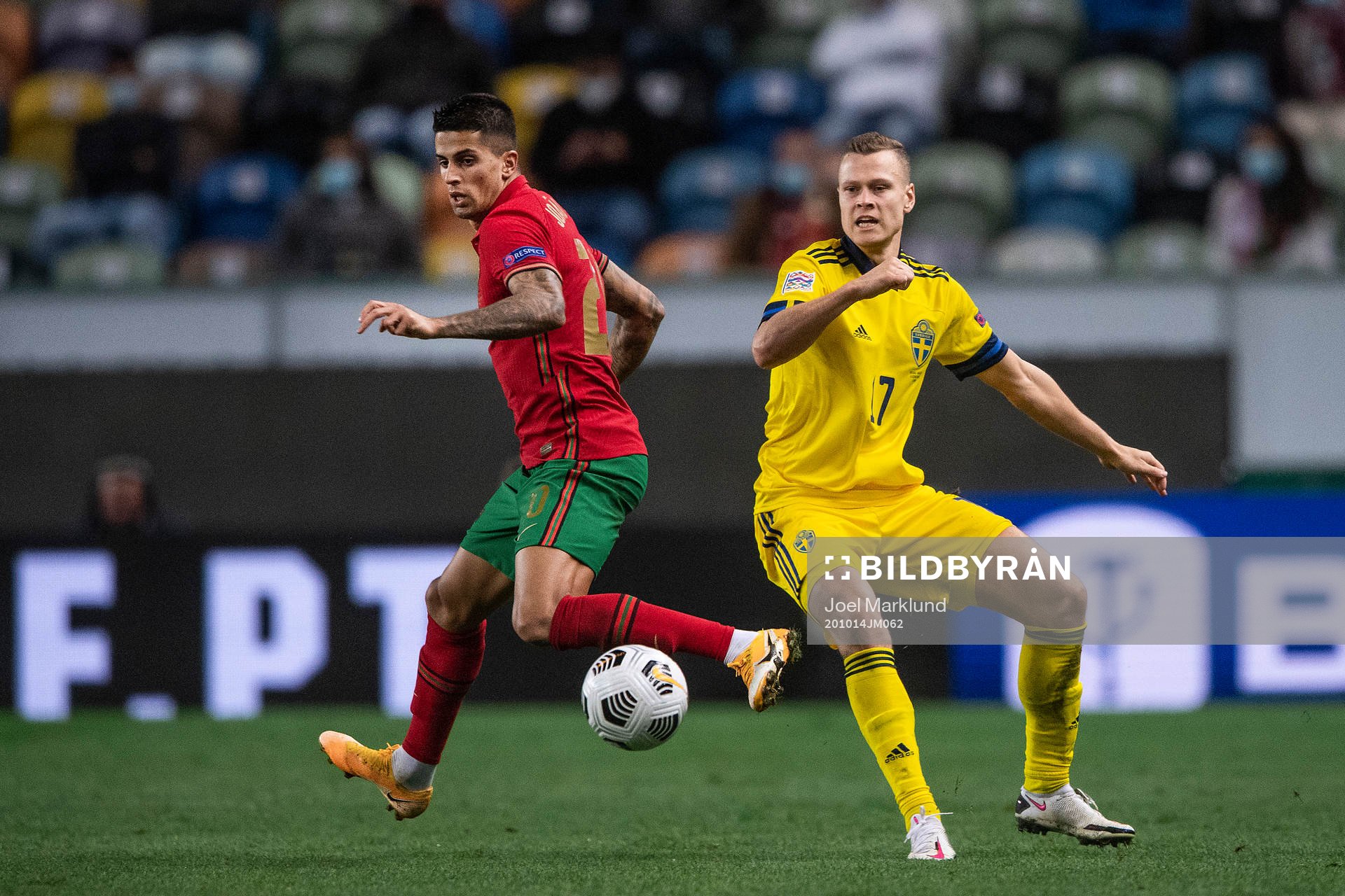Joao Cancelo of Portugal and Viktor Claesson of Sweden