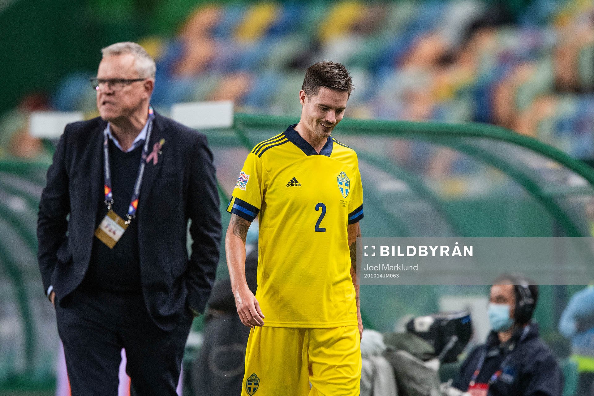 head coach Janne Andersson and Mikael Lustig of Sweden