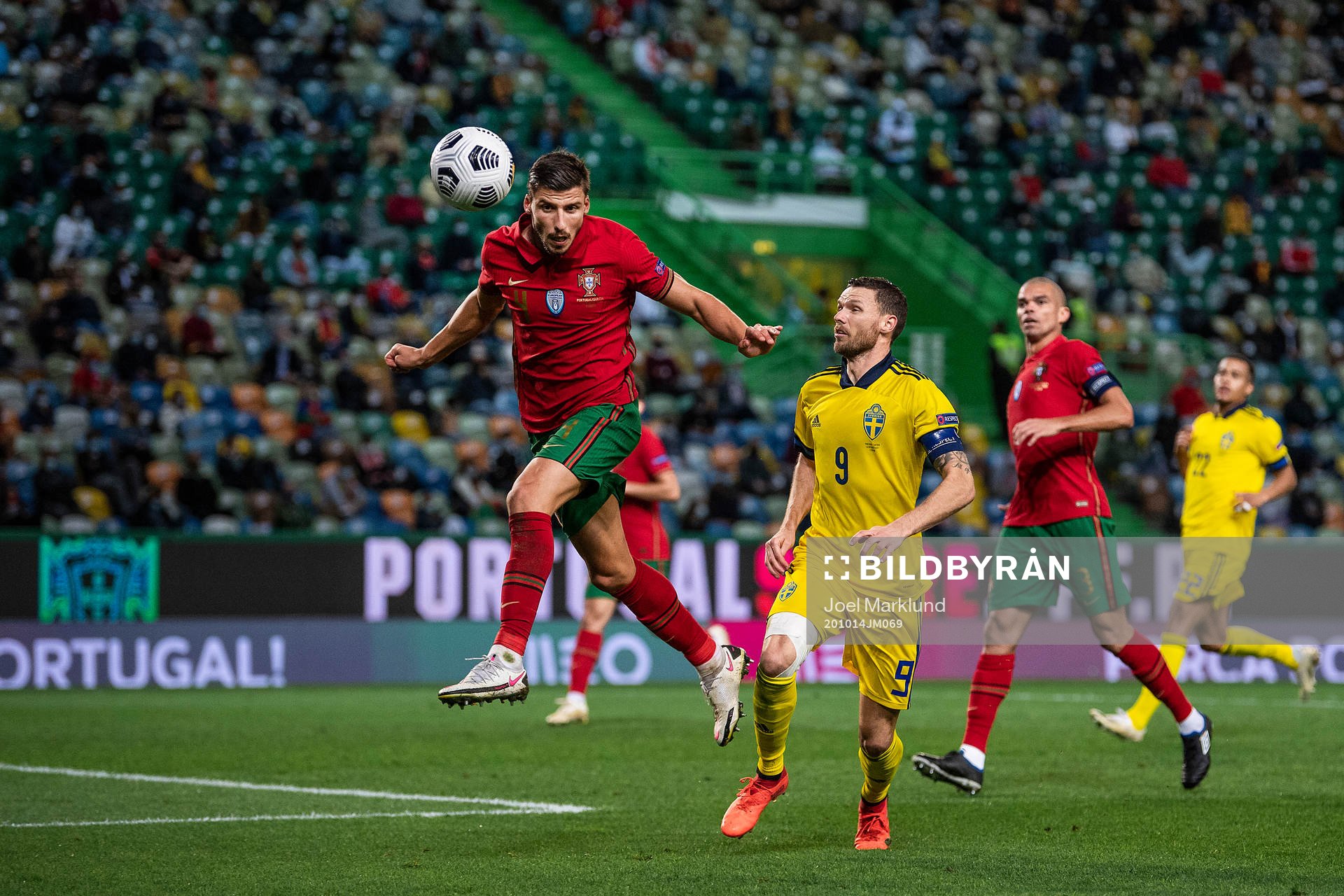 Ruben Dias of Portugal and Marcus Berg of Sweden