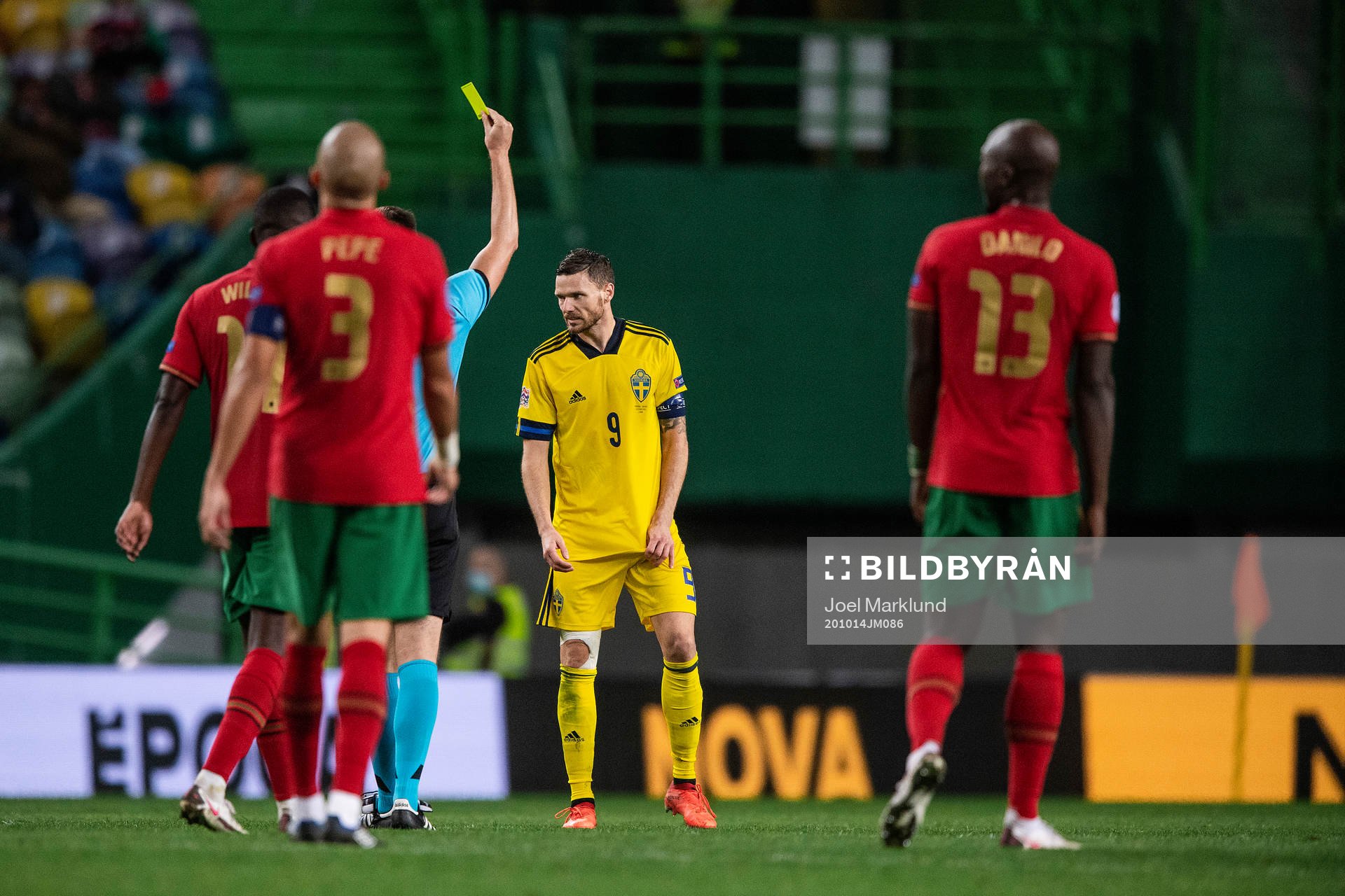 Marcus Berg of Sweden receives a yellow card
