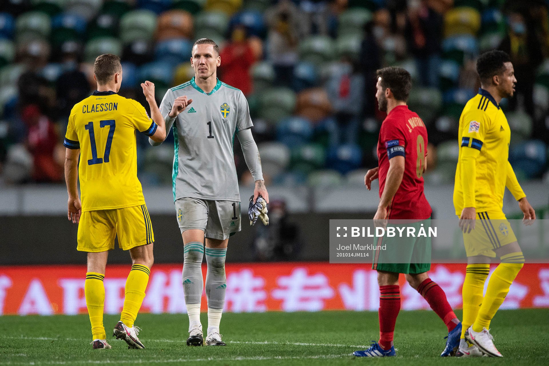 Viktor Claesson and goalkeeper Robin Olsen of Sweden
