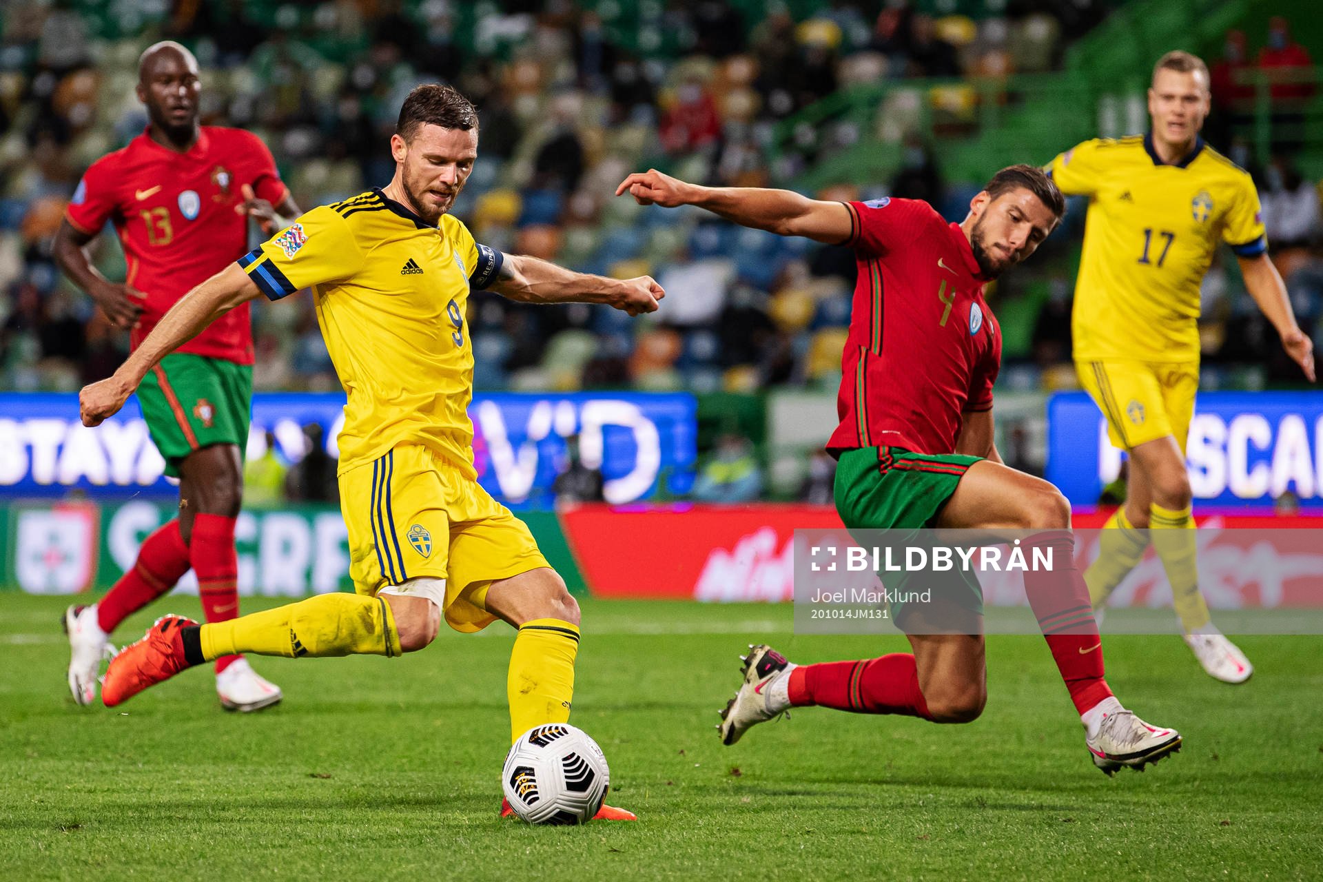 Marcus Berg of Sweden and Ruben Dias of Portugal