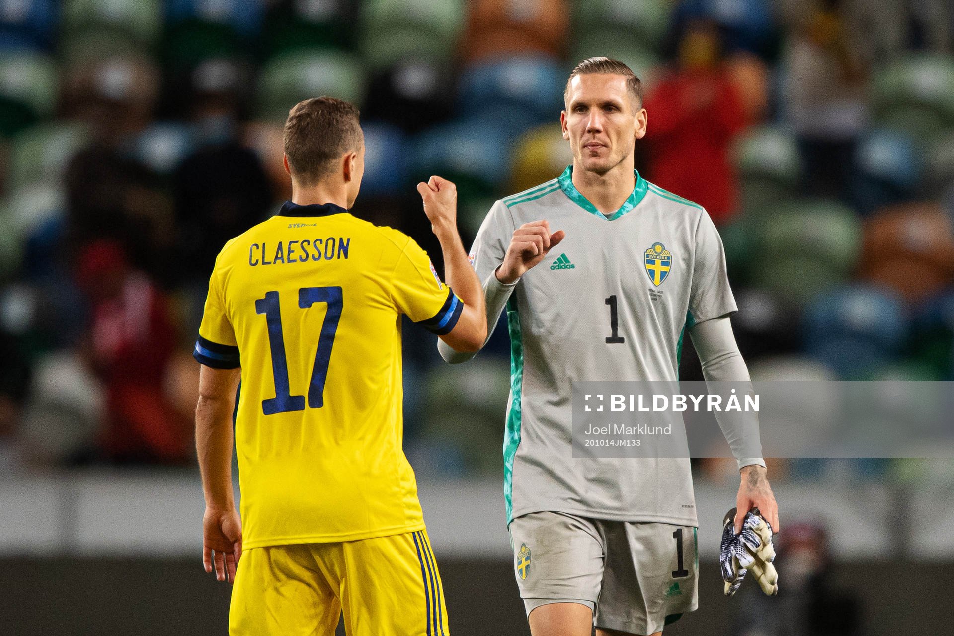 Viktor Claesson and goalkeeper Robin Olsen of Sweden