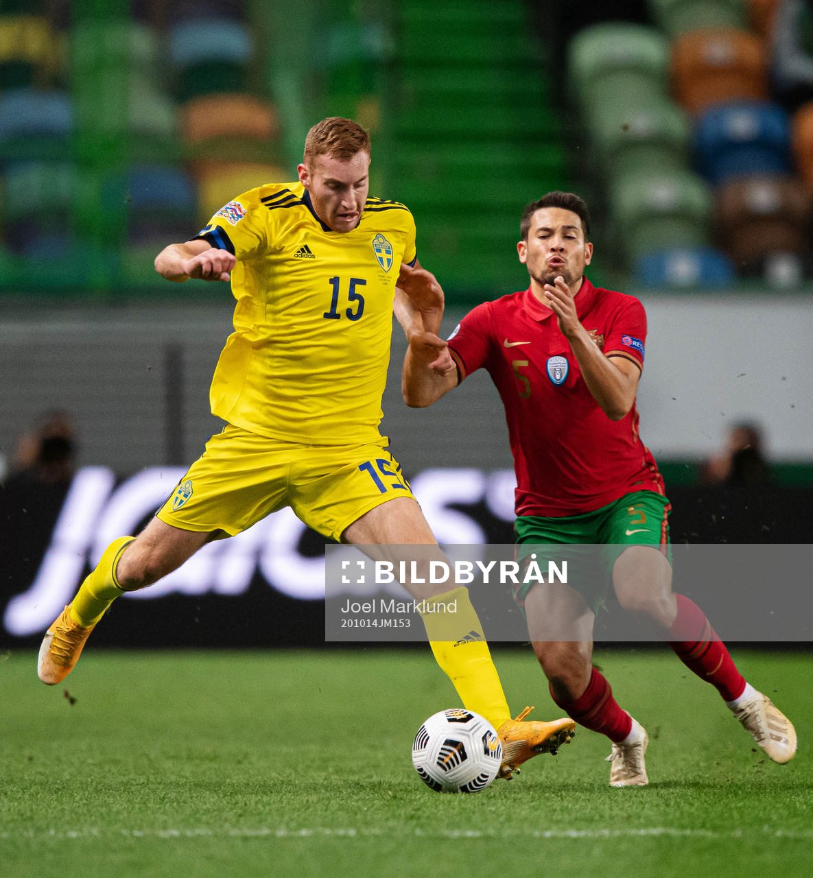 Dejan Kulusevski of Sweden and Raphael Guerreiro of Portugal