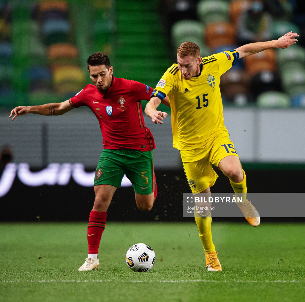 Raphael Guerreiro of Portugal and Dejan Kulusevski of Sweden