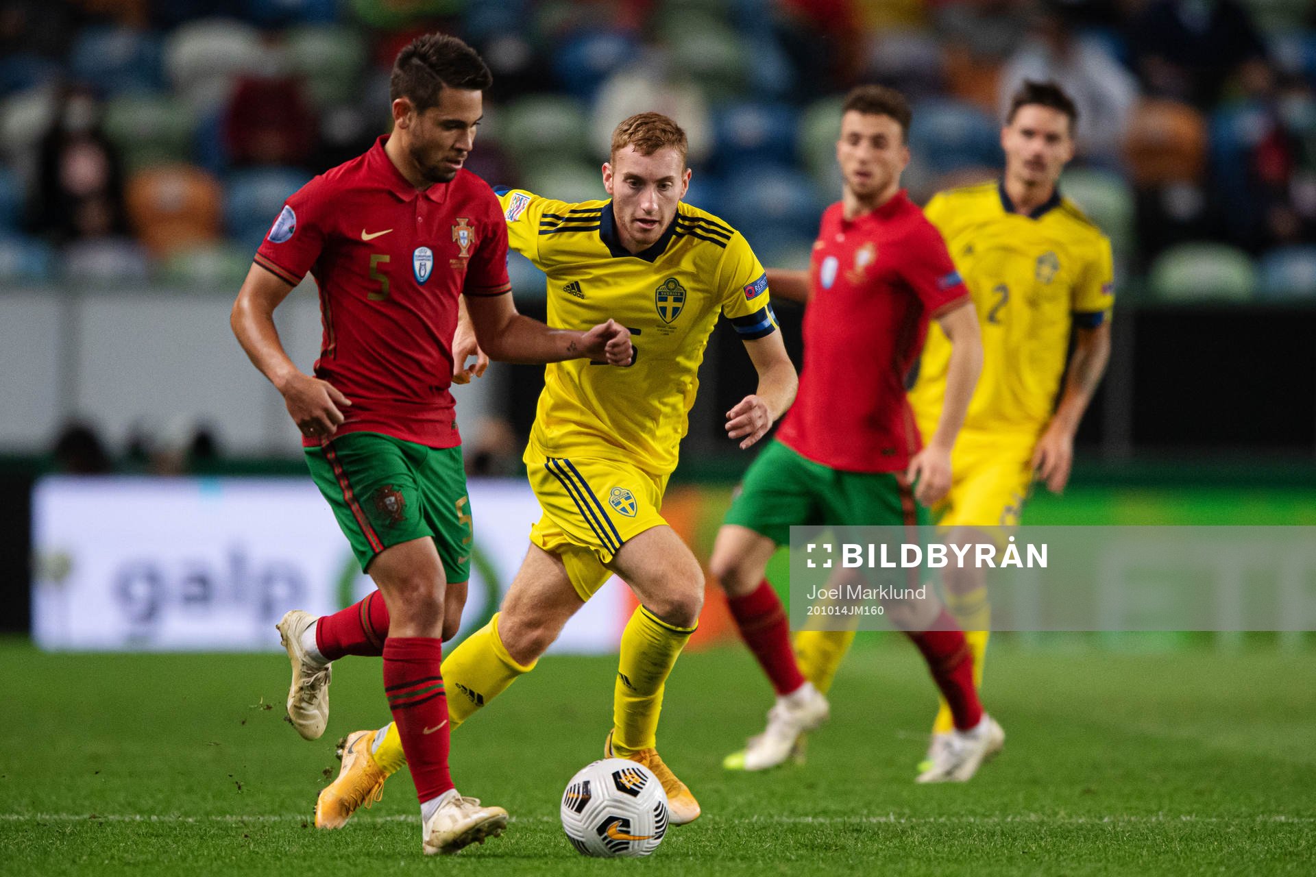 Raphael Guerreiro of Portugal and Dejan Kulusevski of Sweden