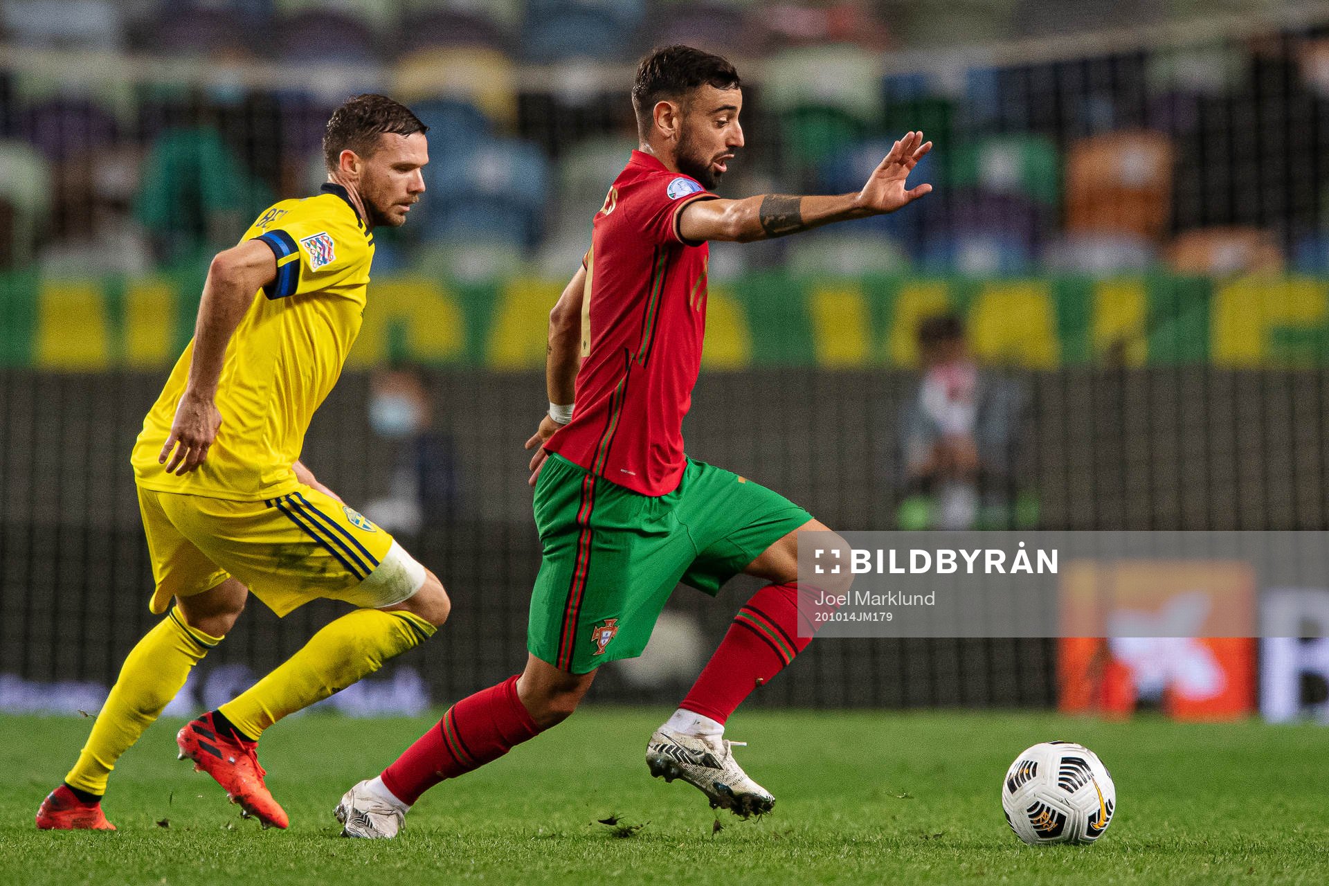 Marcus Berg of Sweden and Bruno Fernandes of Portugal
