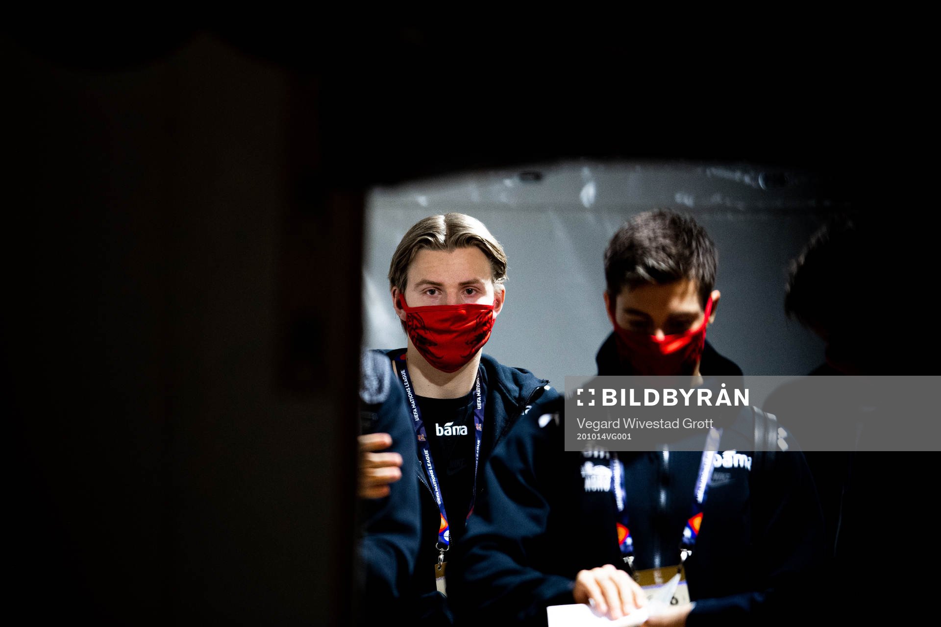 Jens Petter Hauge of Norway arrives wearing a face mask