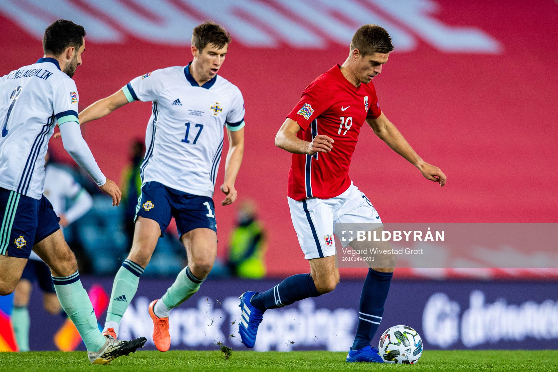 Paddy McNair of Northern Ireland and Markus Henriksen of