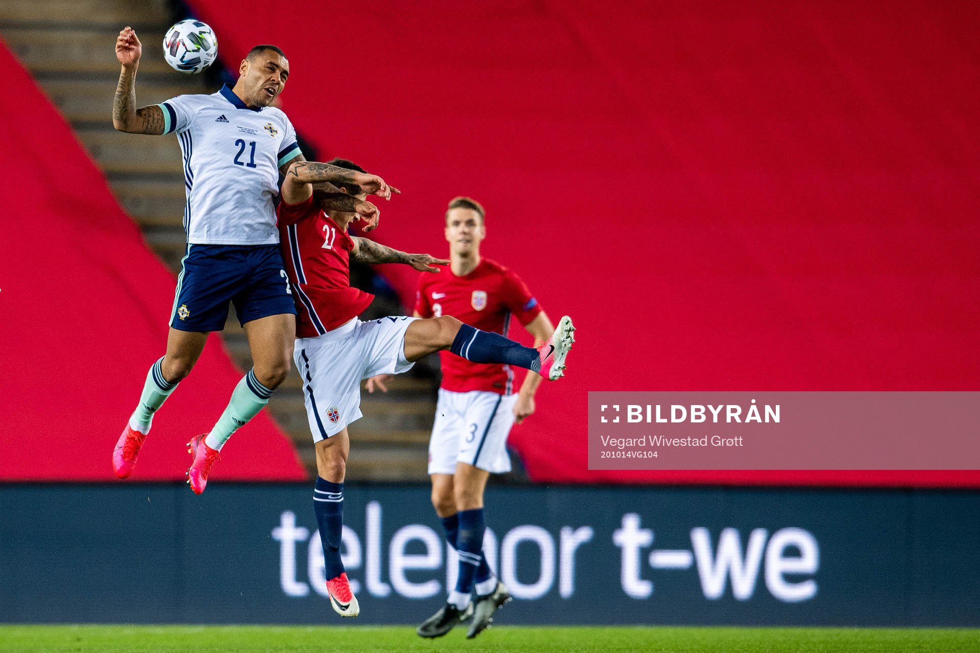 Josh Magennis of Northern Ireland and Mathias Normann of