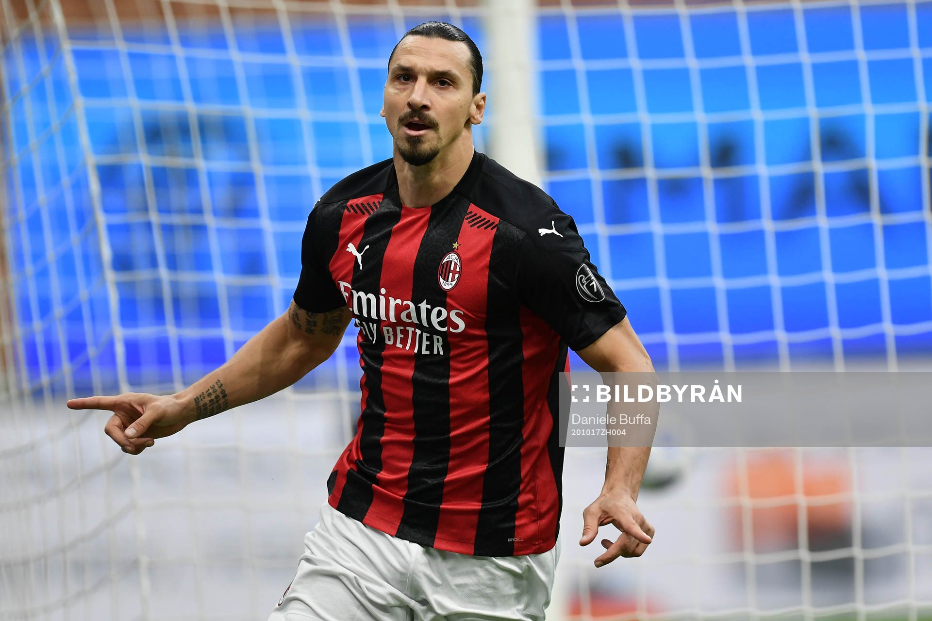 Zlatan Ibrahimovic of Milan celebrates scoring his first