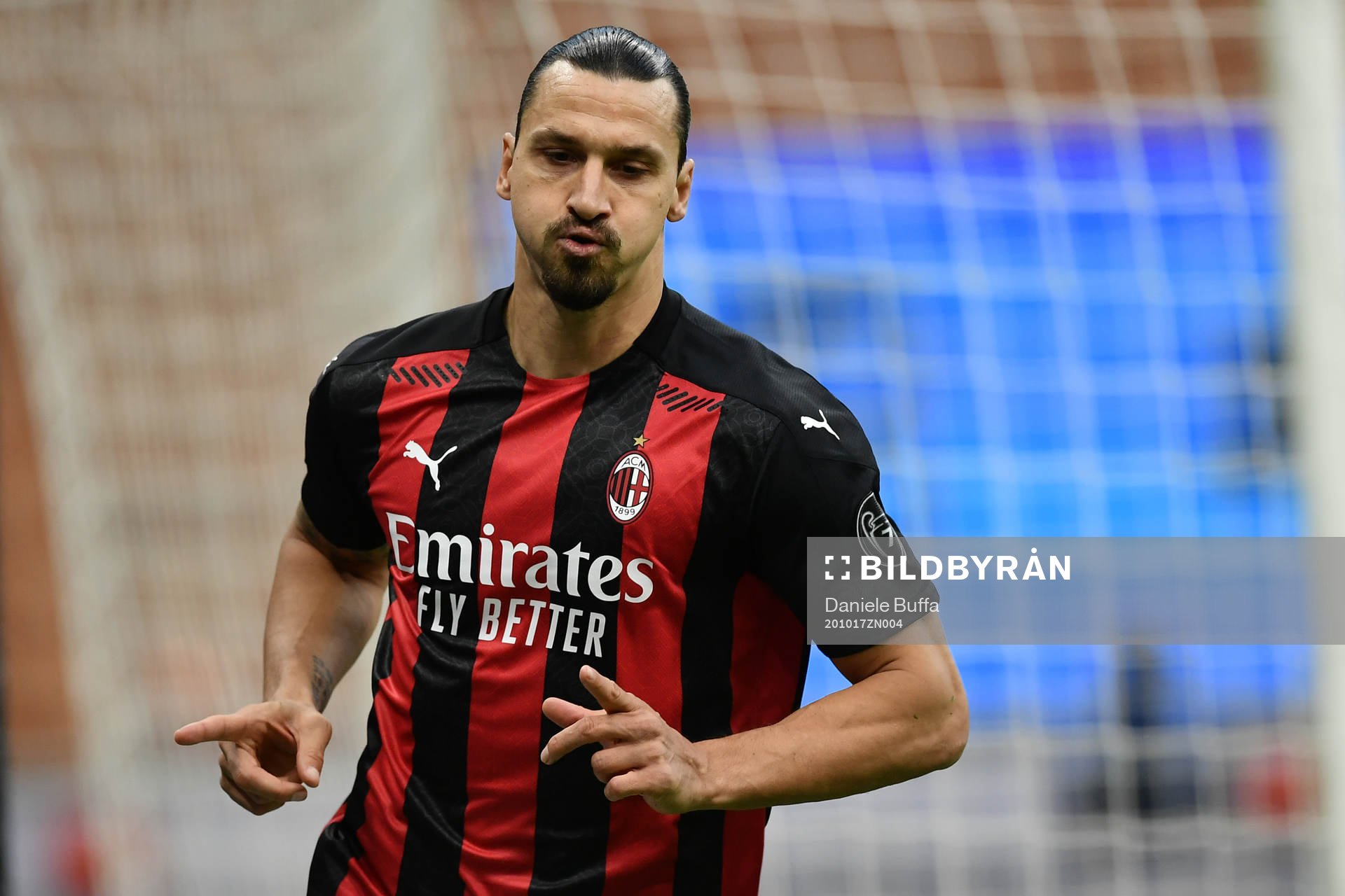 Zlatan Ibrahimovic of Milan celebrates scoring his first