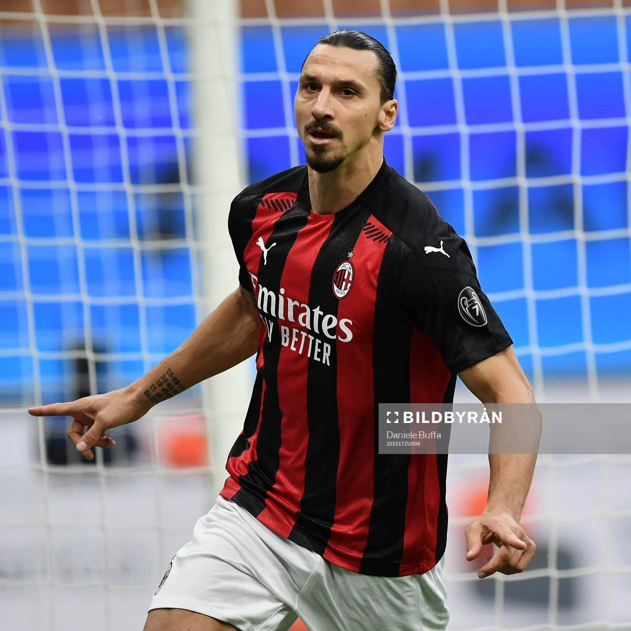 Zlatan Ibrahimovic of Milan celebrates scoring his first