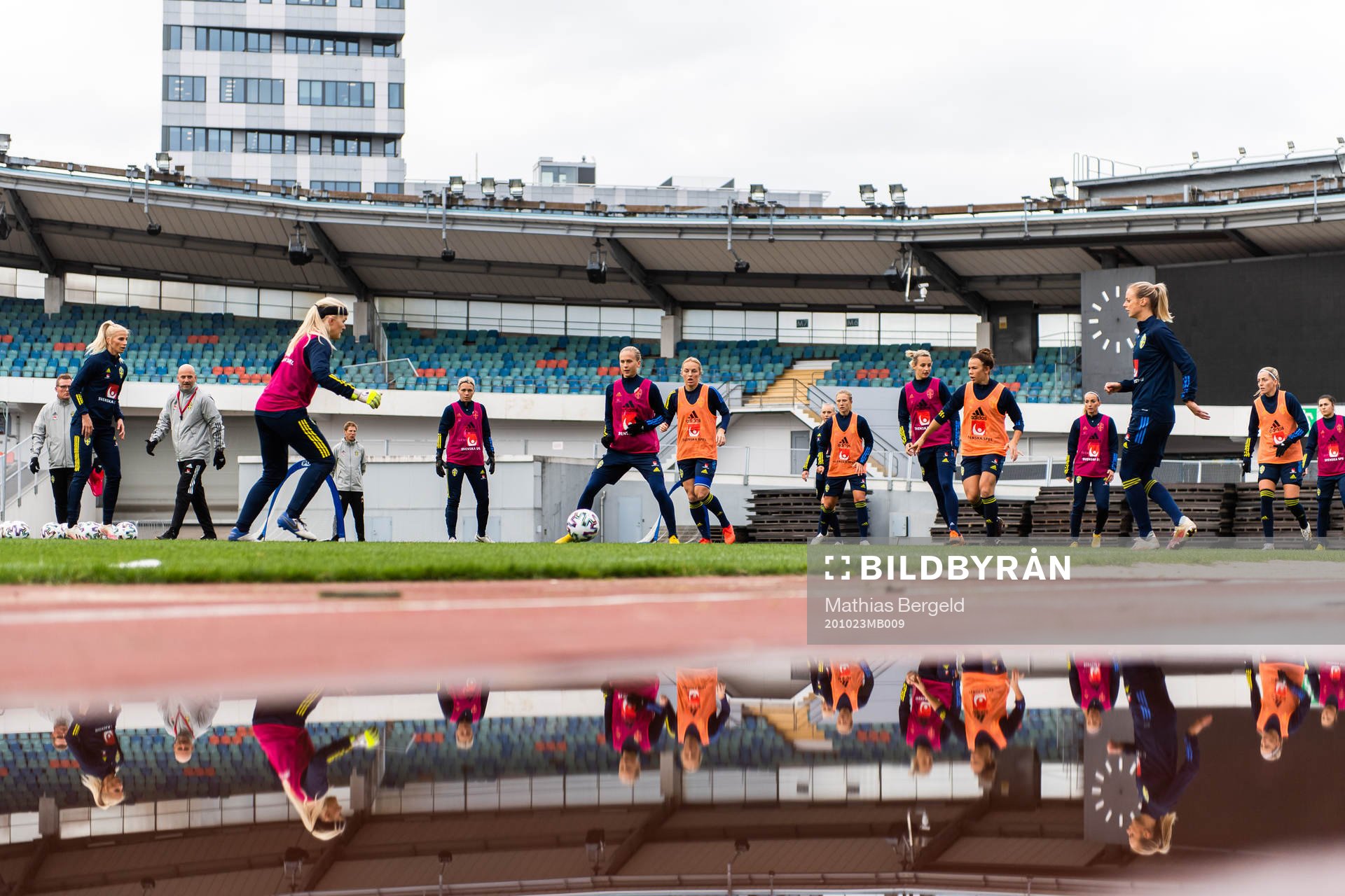 Players reflected in water