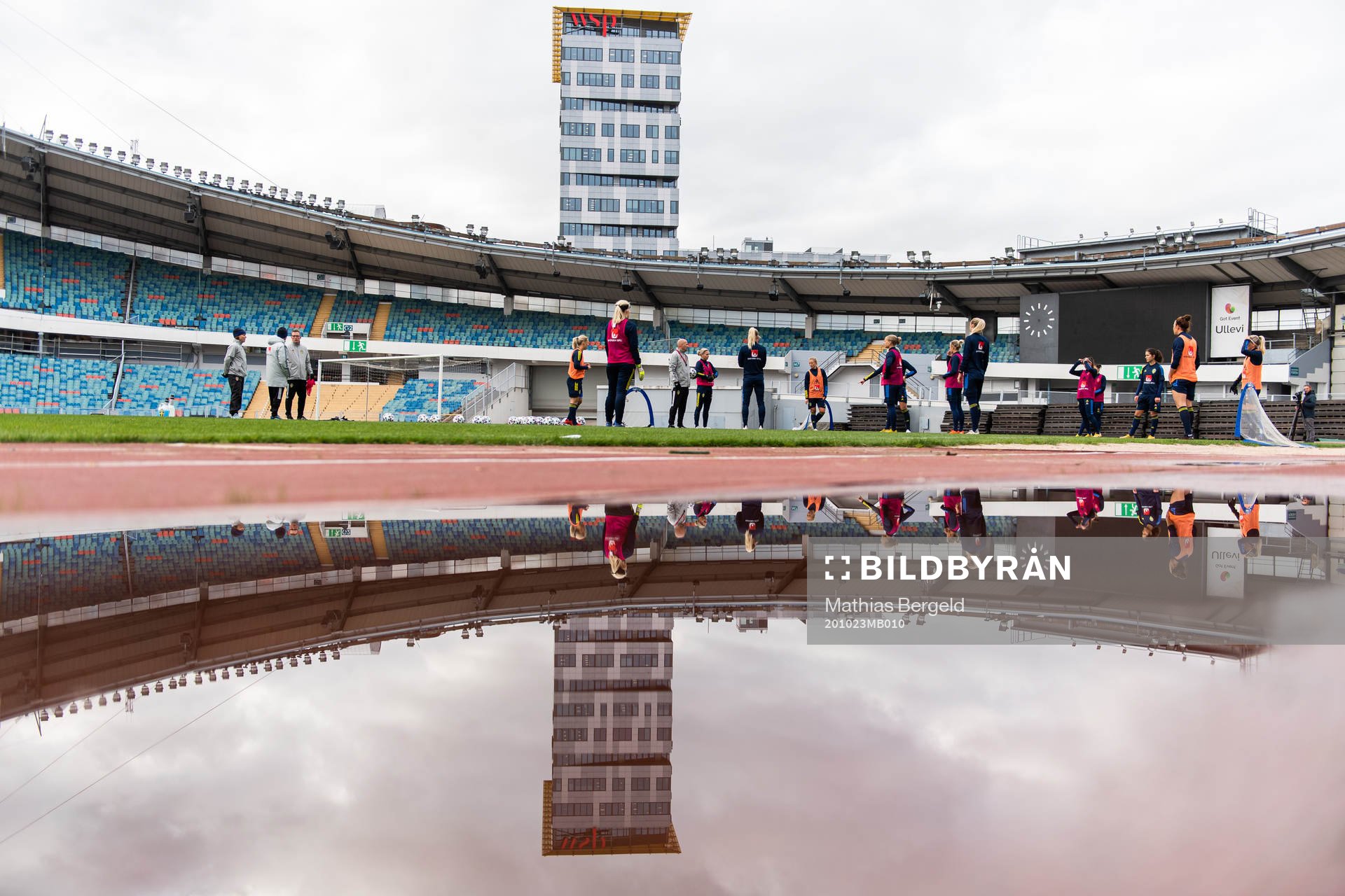 Players reflected in water