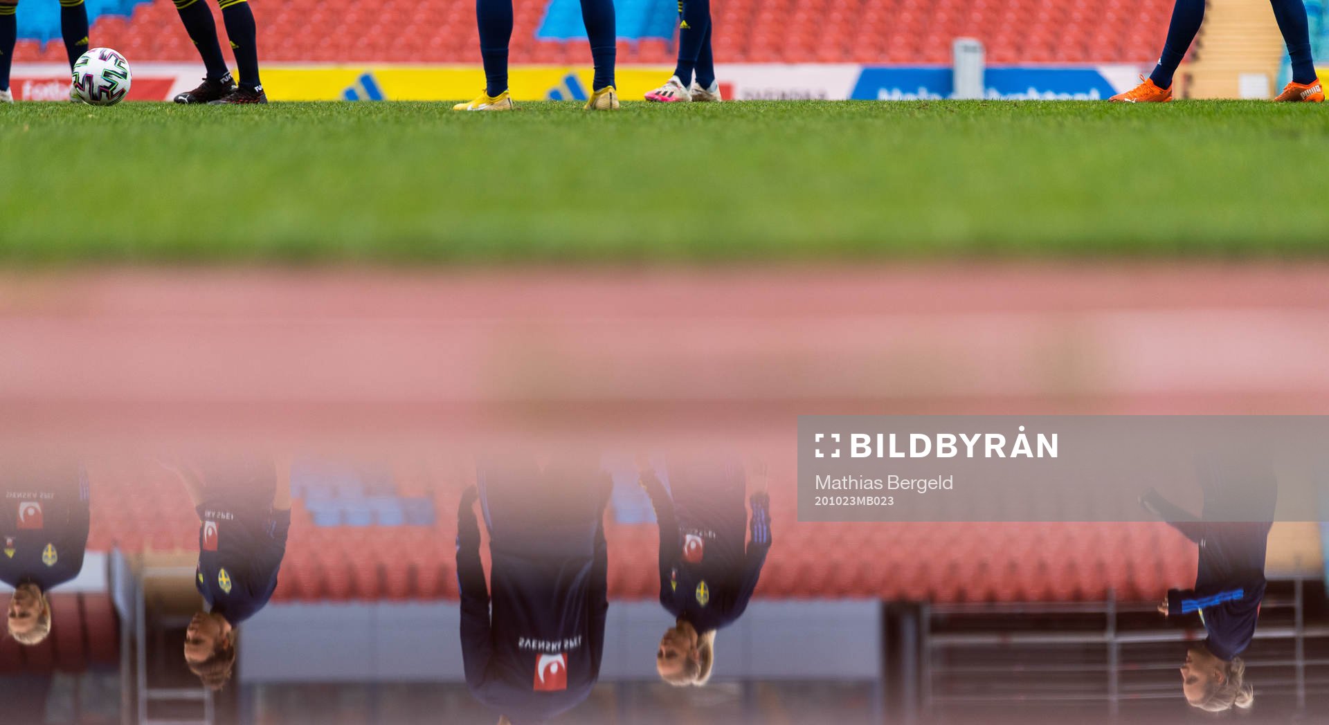 Players reflected in water