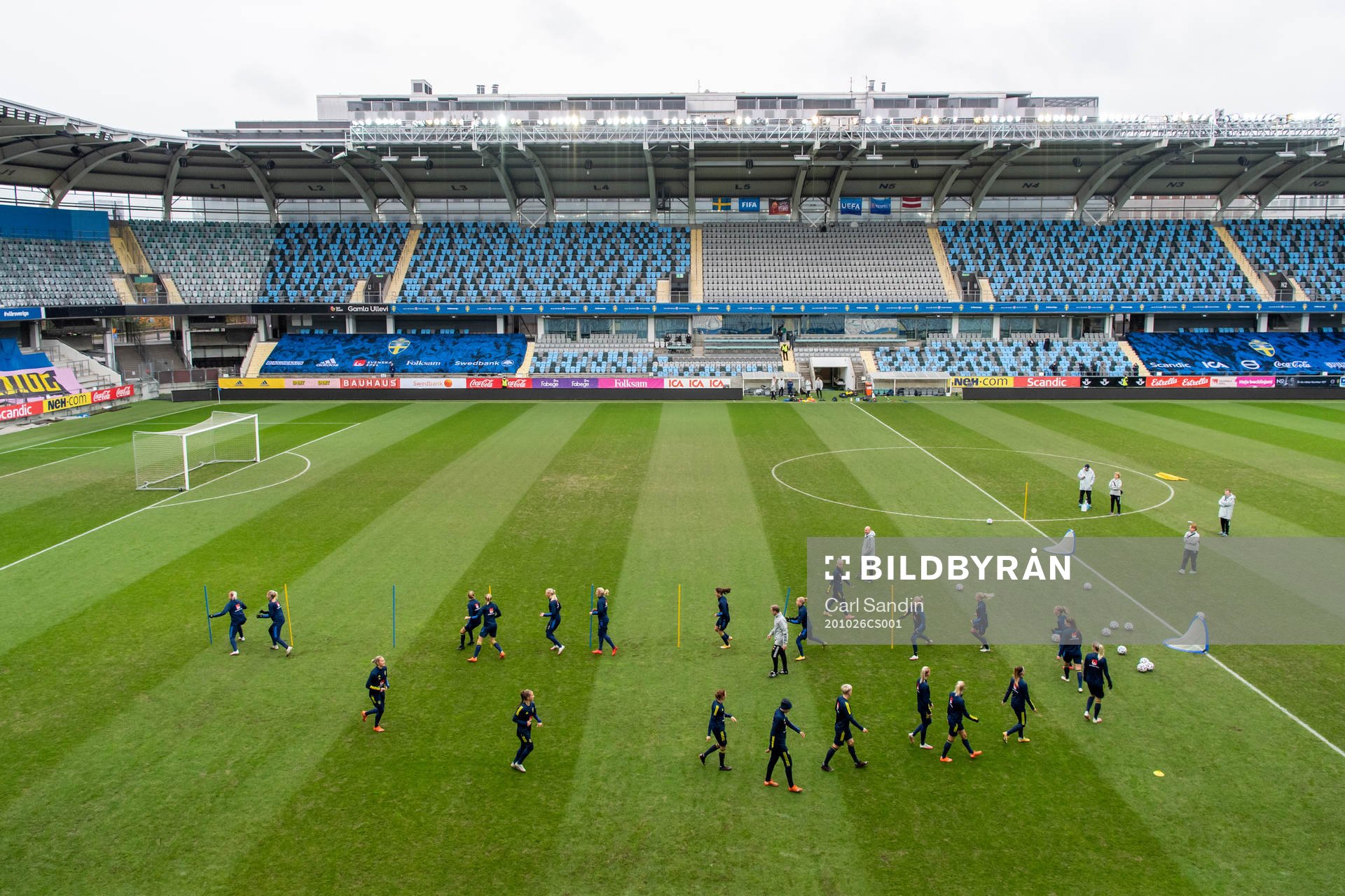 The players warm up in the stadium