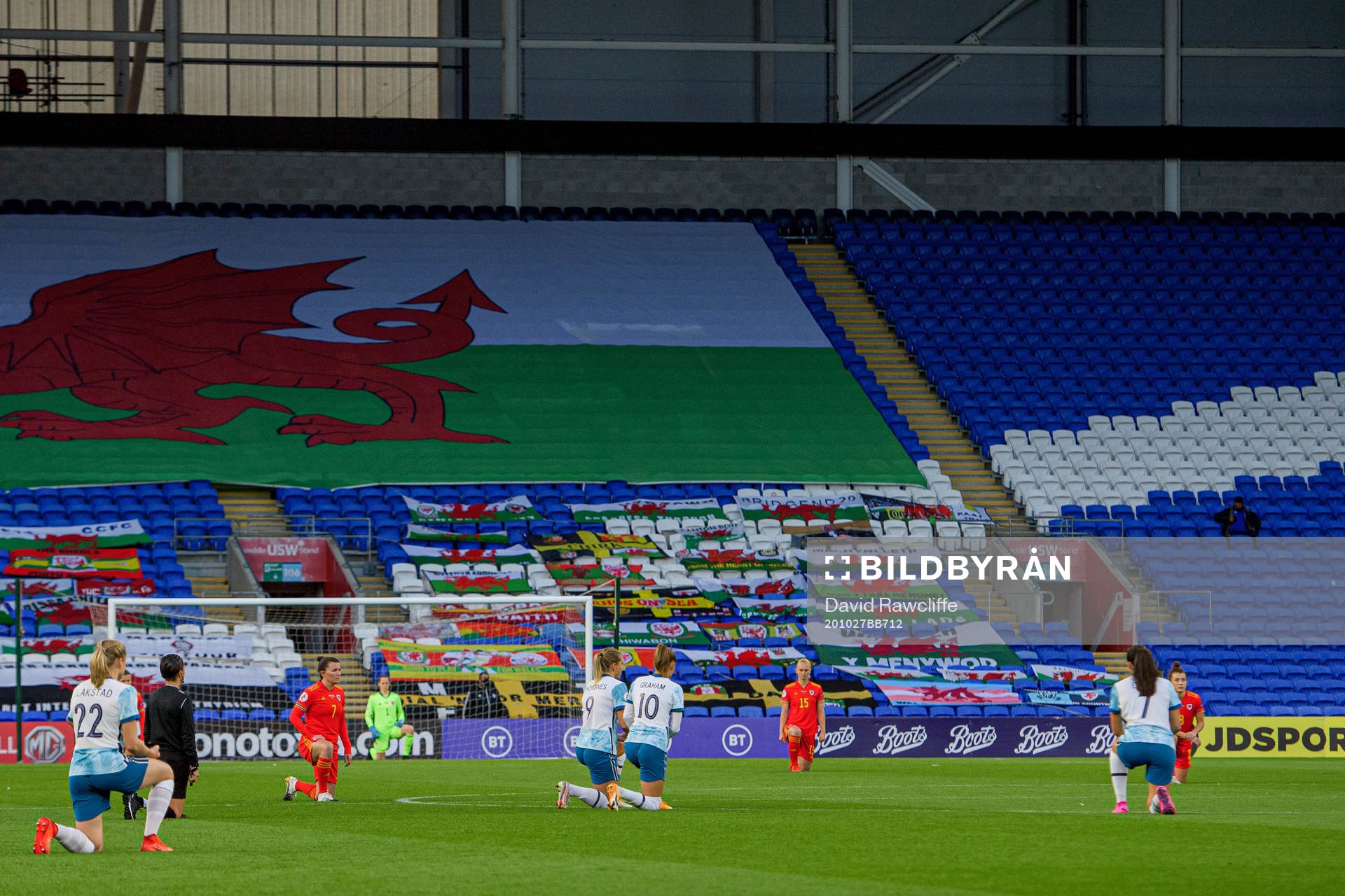 Players of Norway and Wales kneel in support of the Black