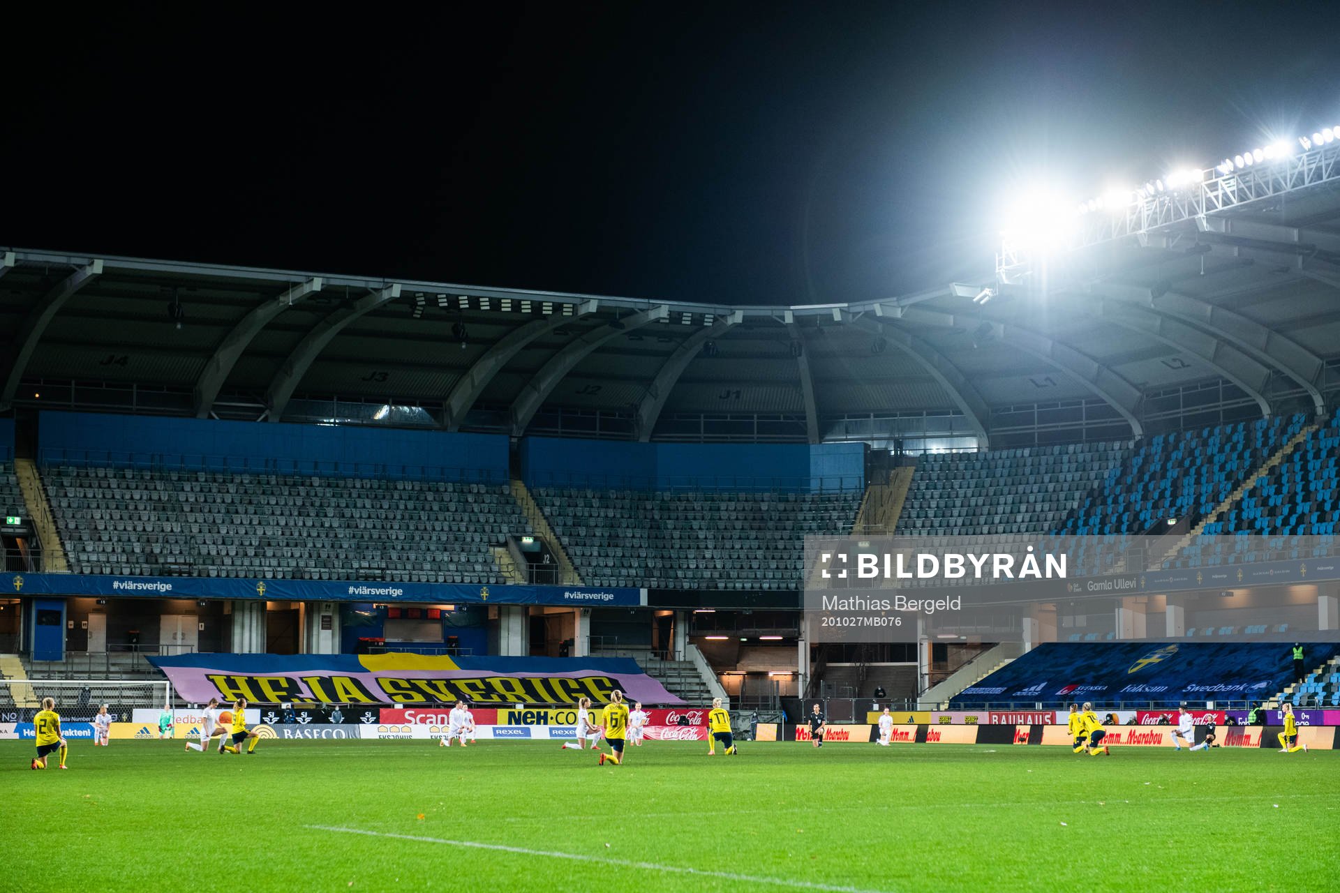 Players of Iceland and of Sweden kneel in support of the