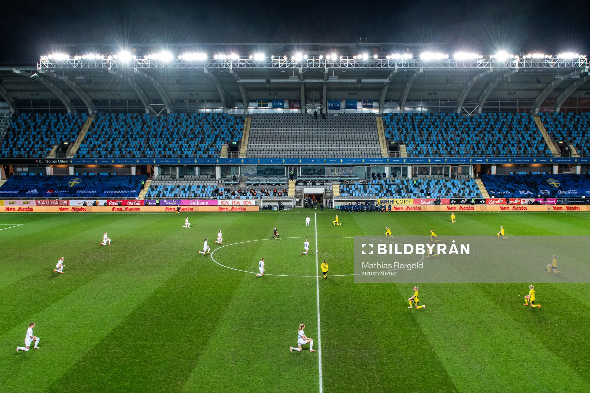 Players of Sweden and Iceland kneel in support of the