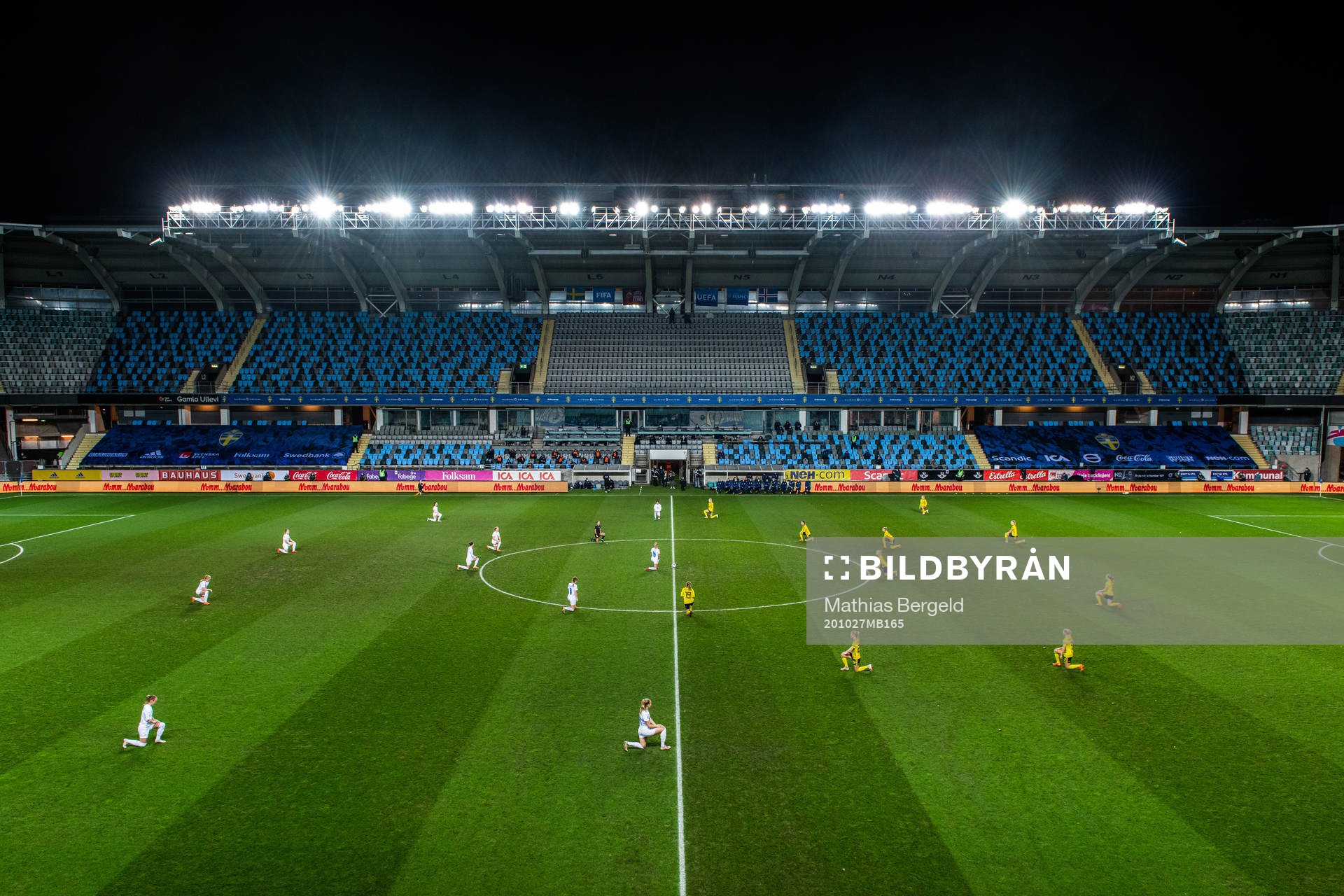 Players of Sweden and Iceland kneel in support of the