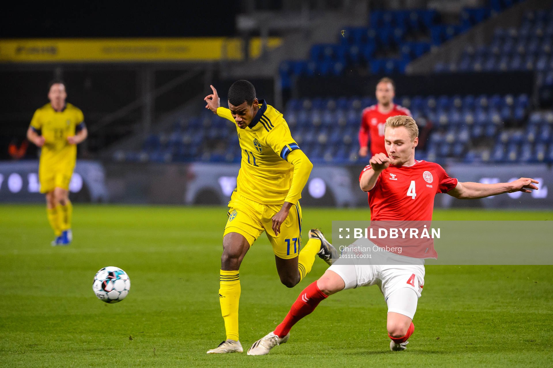 Alexander Isak of Sweden and Andreas Maxsø of Denmark