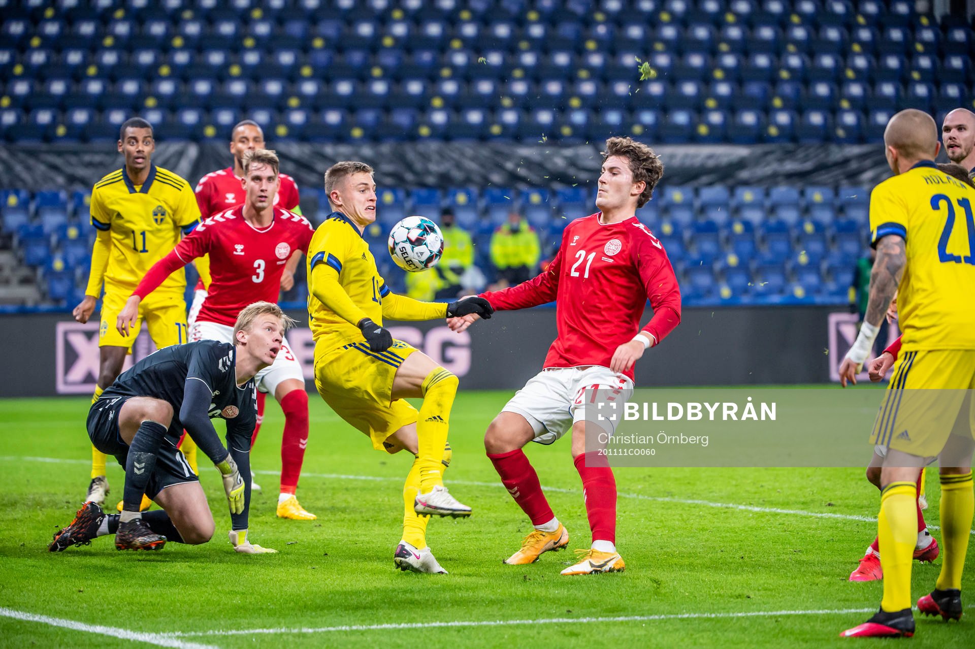 Mattias Svanberg of Sweden and Jonas Wind, goalkeeper