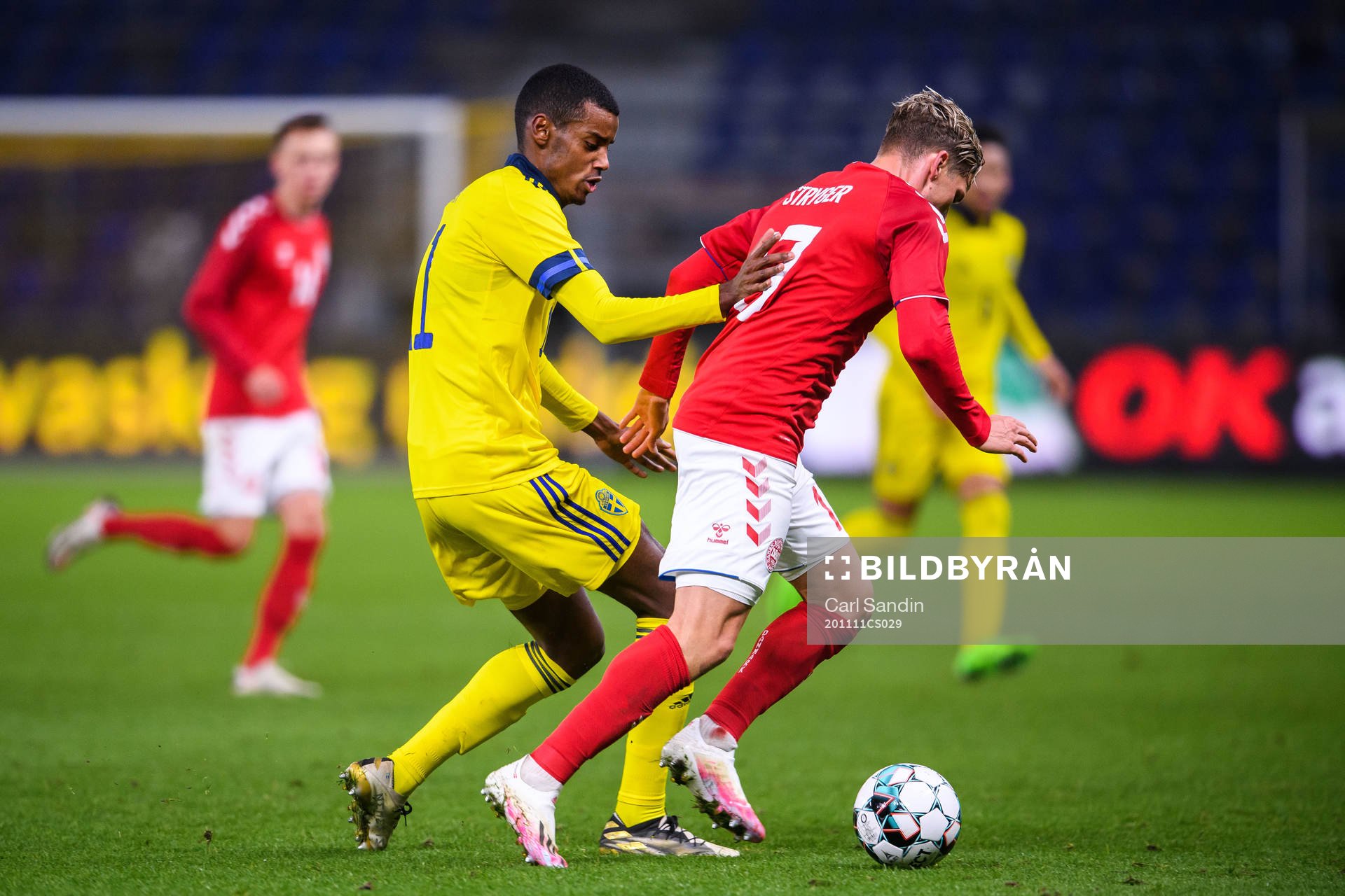 Alexander Isak of Sweden and Jens Stryger Larsen of Denmark