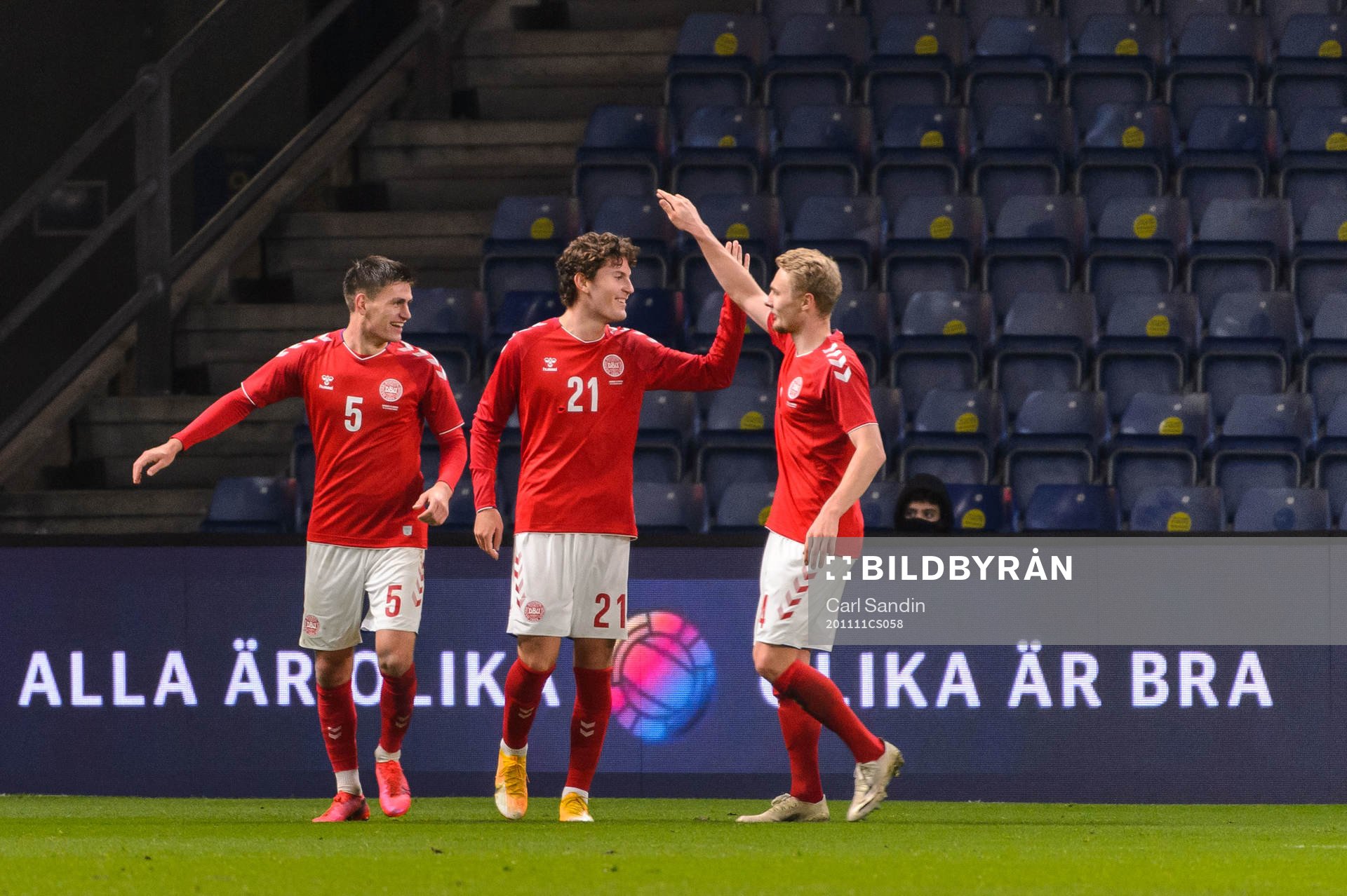 Jonas Wind of Denmark celebrate with teammates