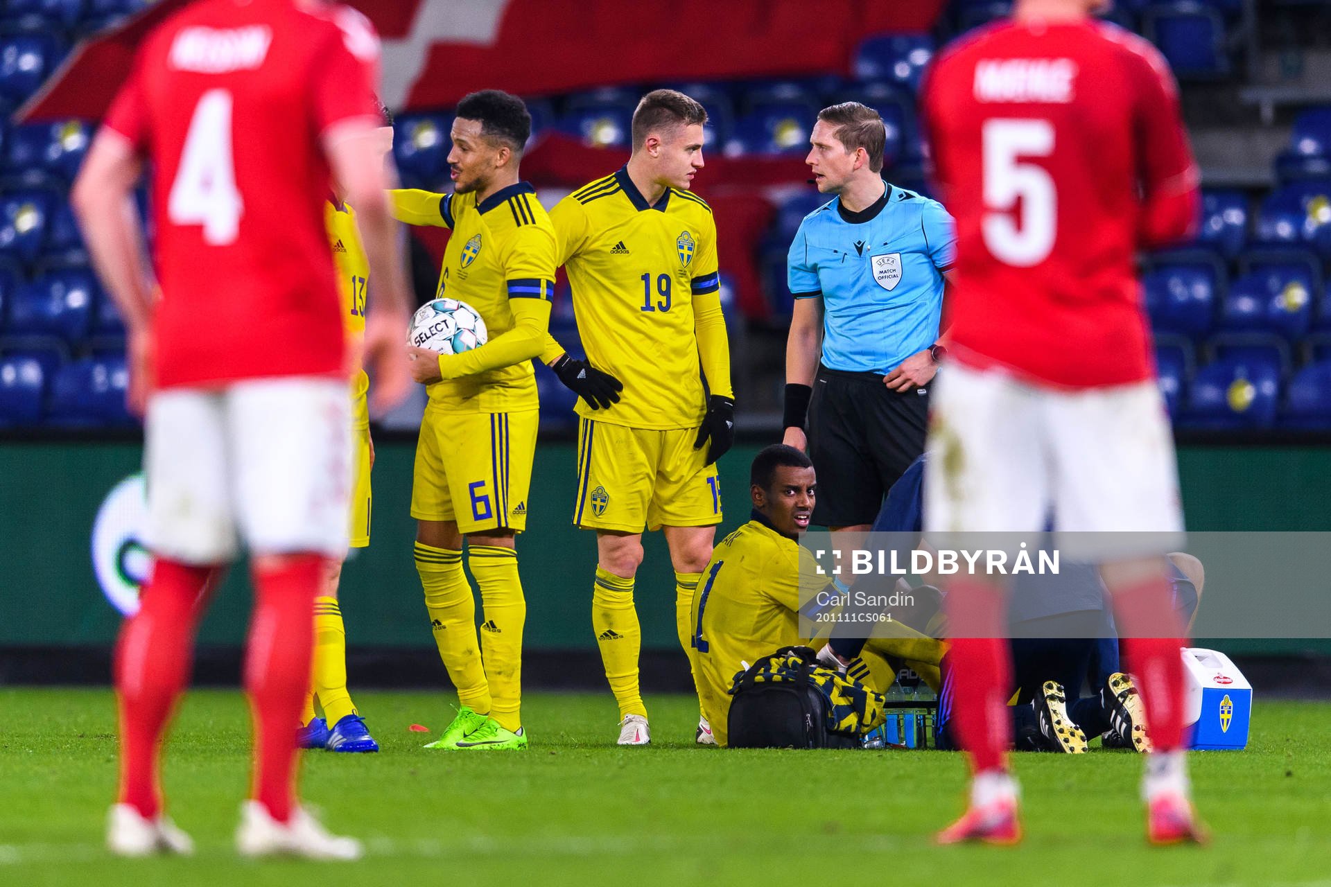 Alexander Isak of Sweden receives medical attention