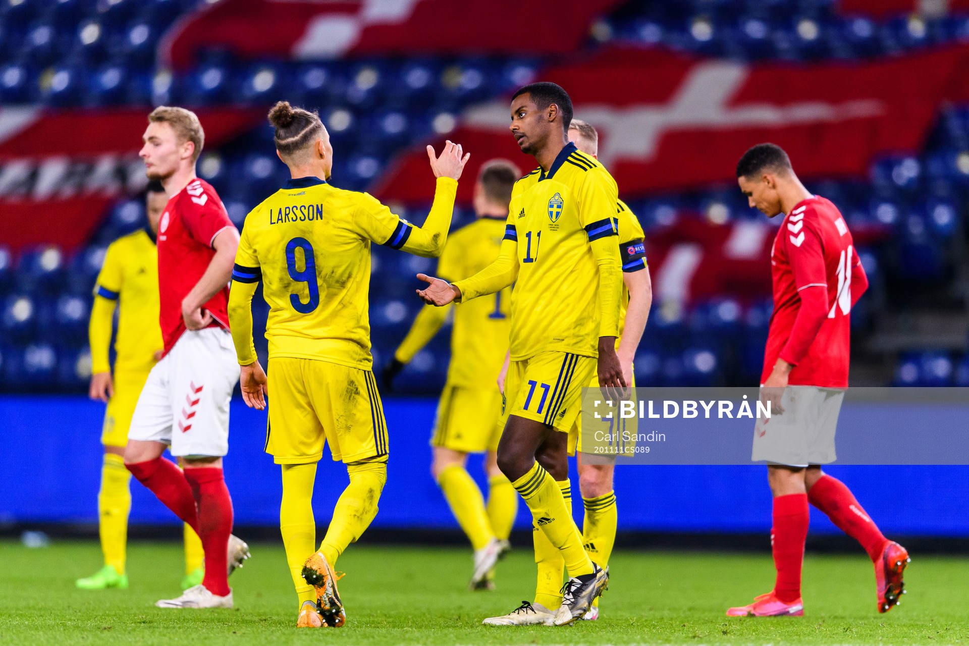 Jordan Larsson and Alexander Isak of Sweden look dejected