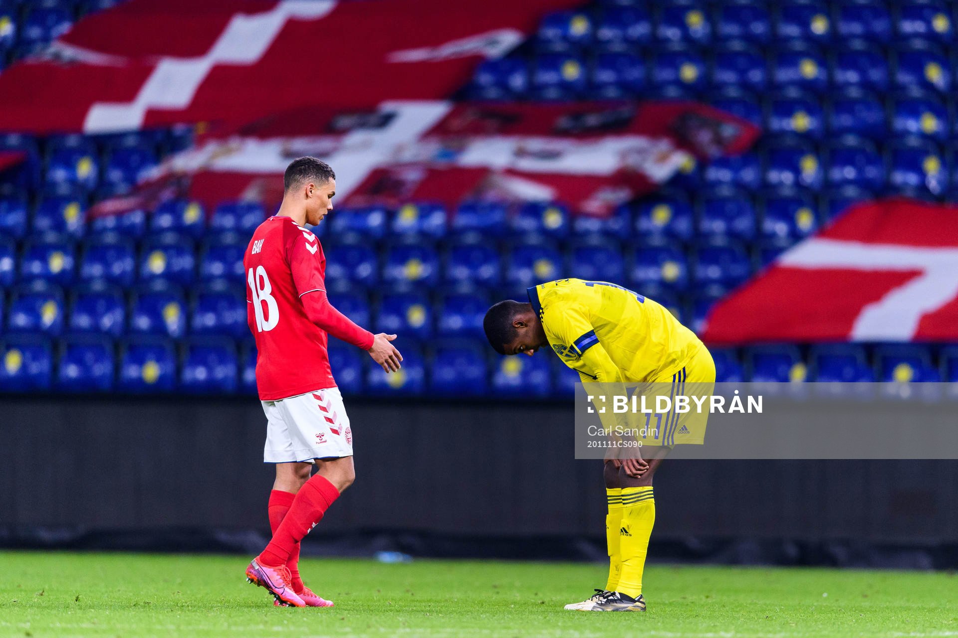 Alexander Bah of Denmark and Alexander Isak of Sweden