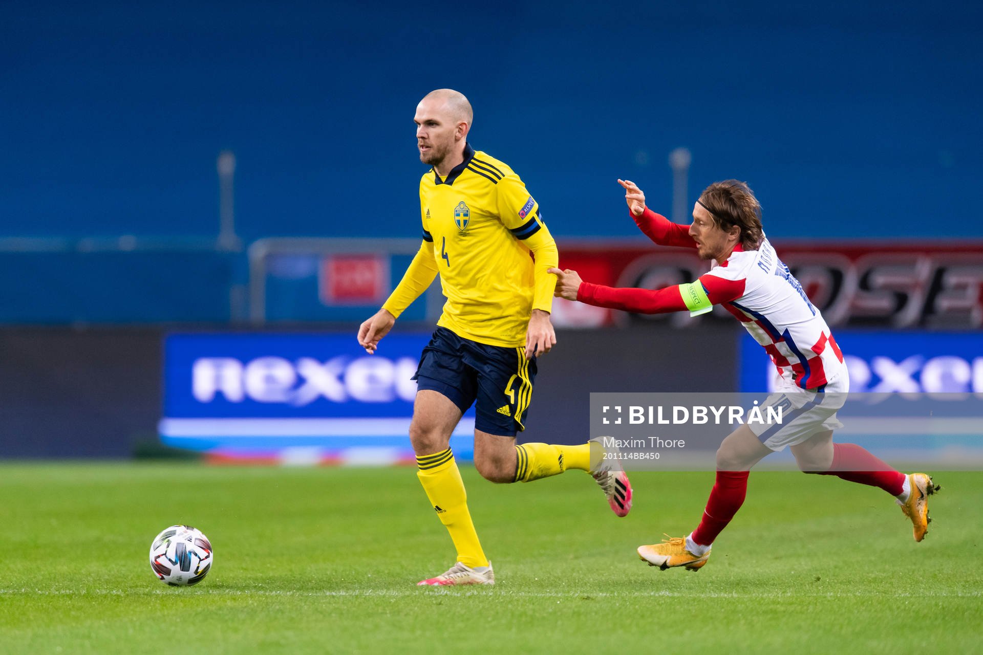Marcus Danielson of Sweden and Luka Modric of Croatia