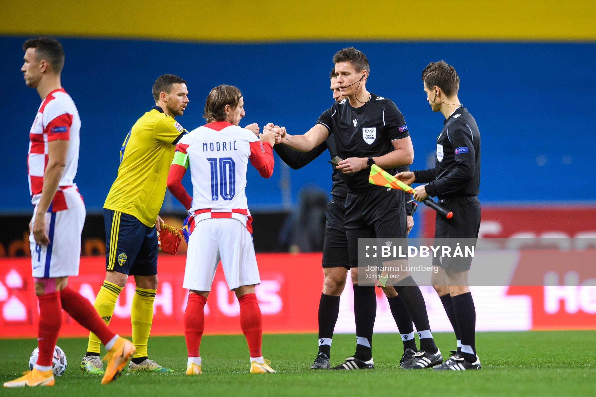 Marcus Berg of Sweden and Luka Modric of Croatia