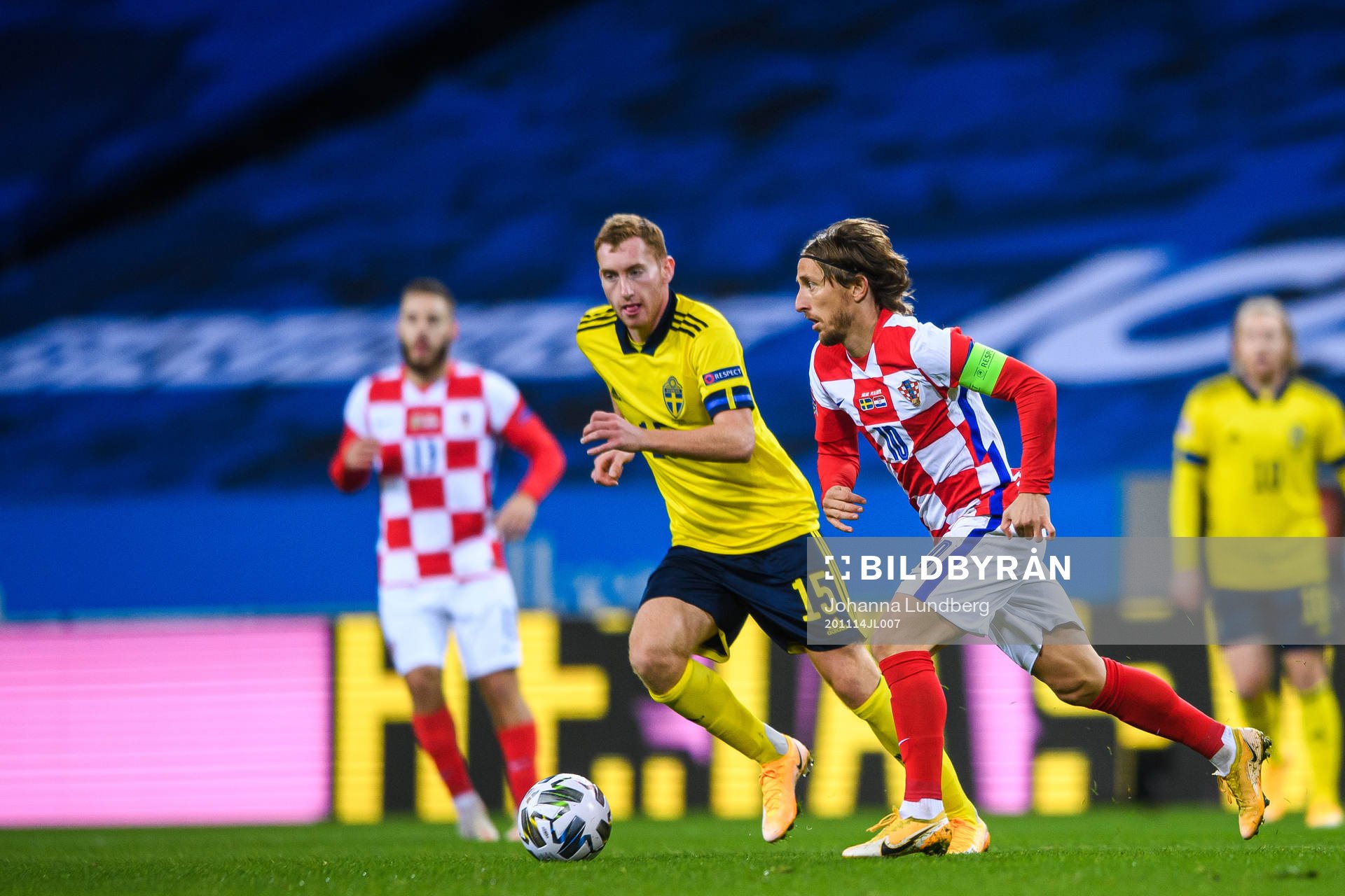 Dejan Kulusevski of Sweden and Luka Modric of Croatia
