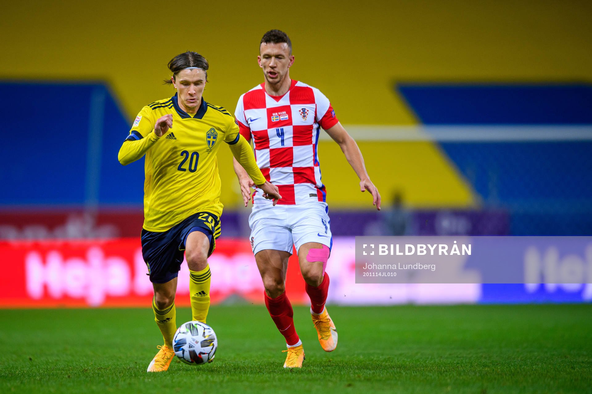 Kristoffer Olsson of Sweden and Ivan Perisic of Croatia