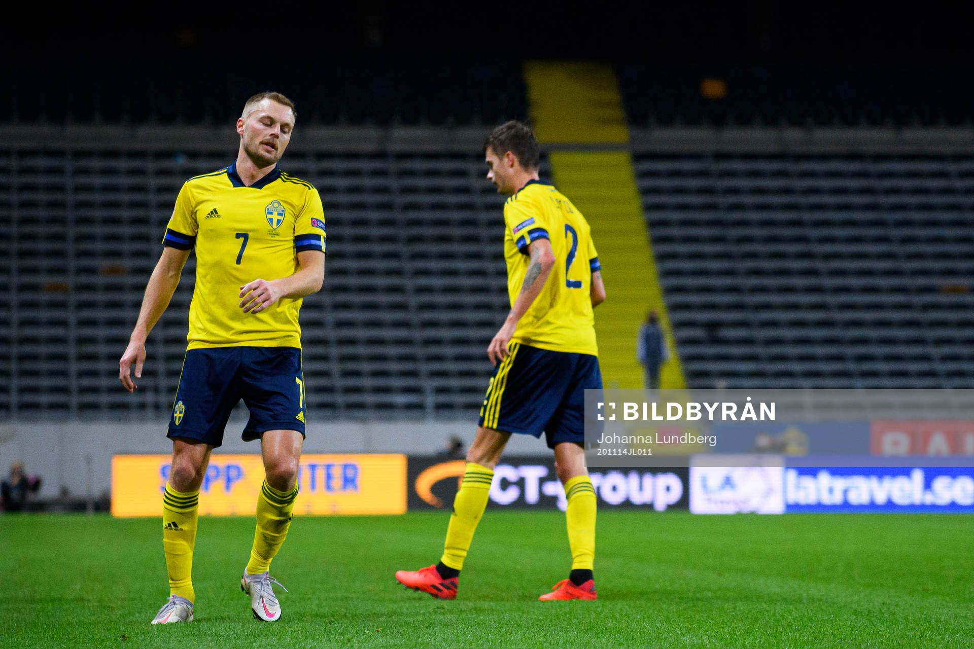 Sebastian Larsson and Mikael Lustig of Sweden look dejected