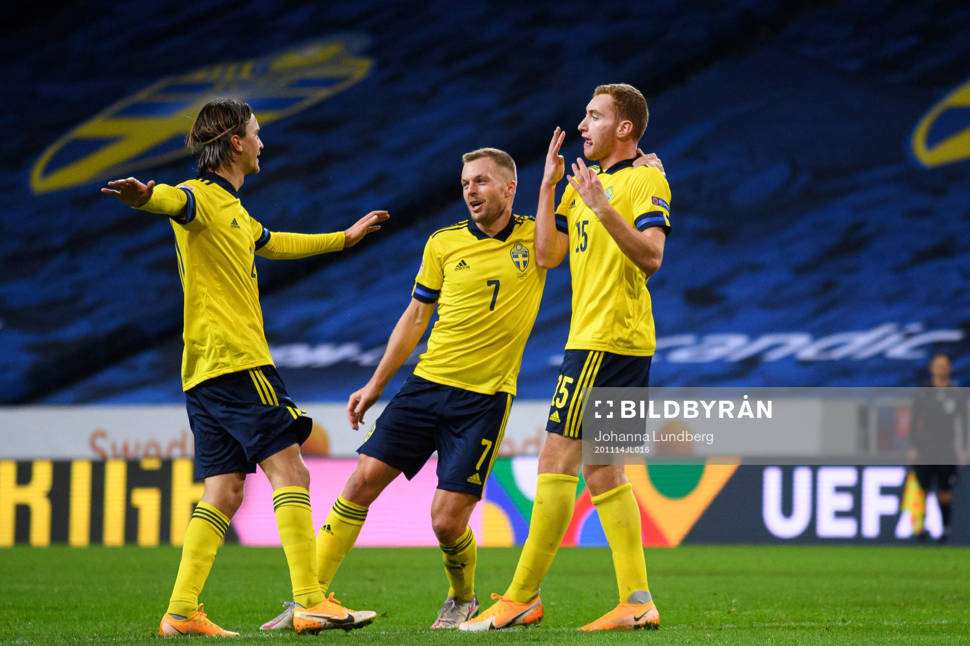 Kristoffer Olsson , Sebastian Larsson and Dejan Kulusevski of Sweden celebrate the 1-0 goal during the Nations League football match between Sweden and Croatia on November 14, 2020 in Stockholm.