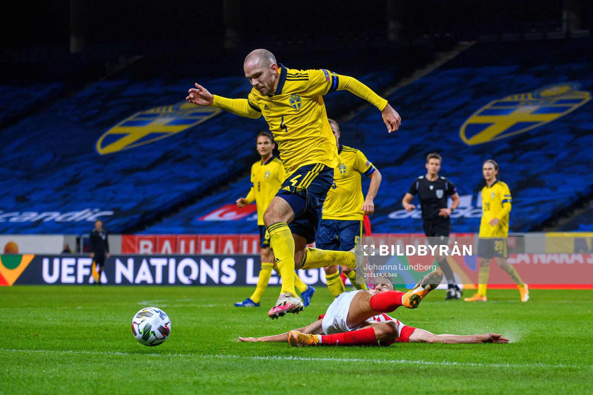 Kristoffer Olsson of Sweden and Ivan Perisic of Croatia