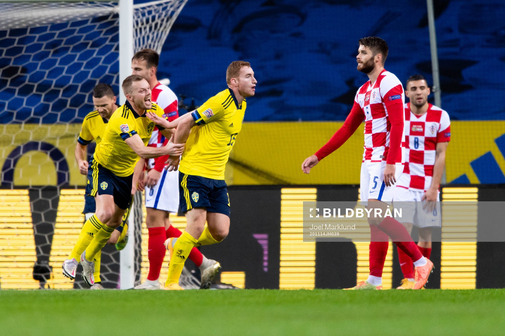 Sebastian Larsson and Dejan Kulusevski of Sweden celebrate