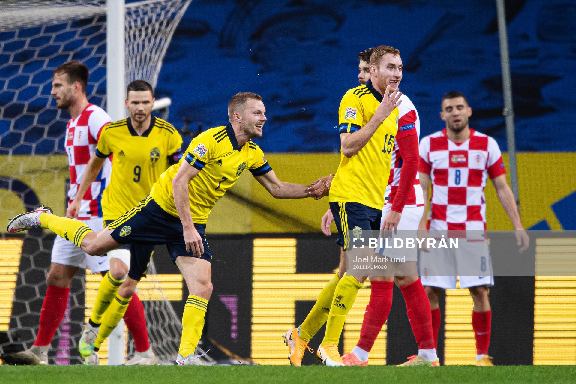 Sebastian Larsson and Dejan Kulusevski of Sweden celebrate