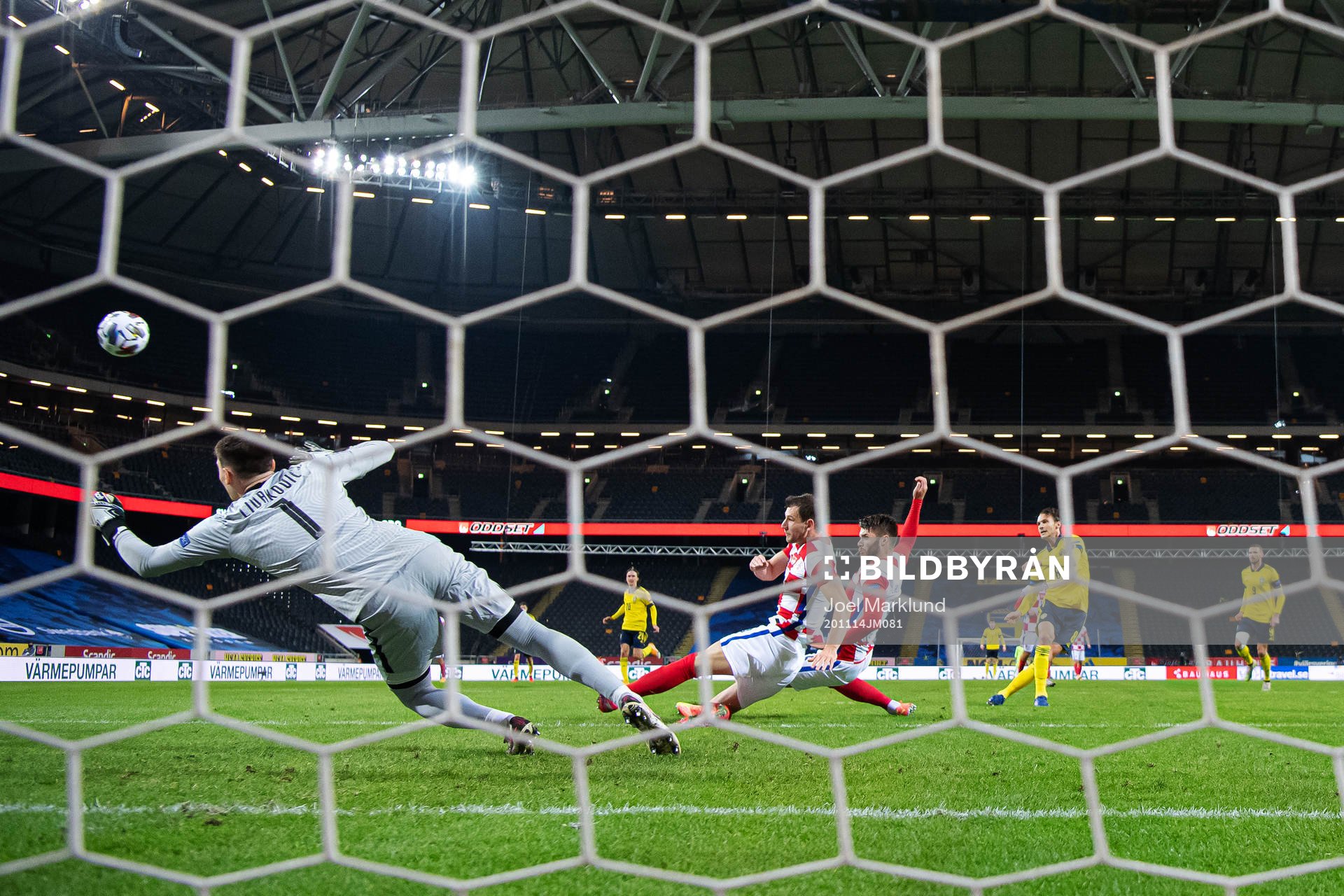 Marcus Berg of Sweden (r) with a shot against goalkeeper